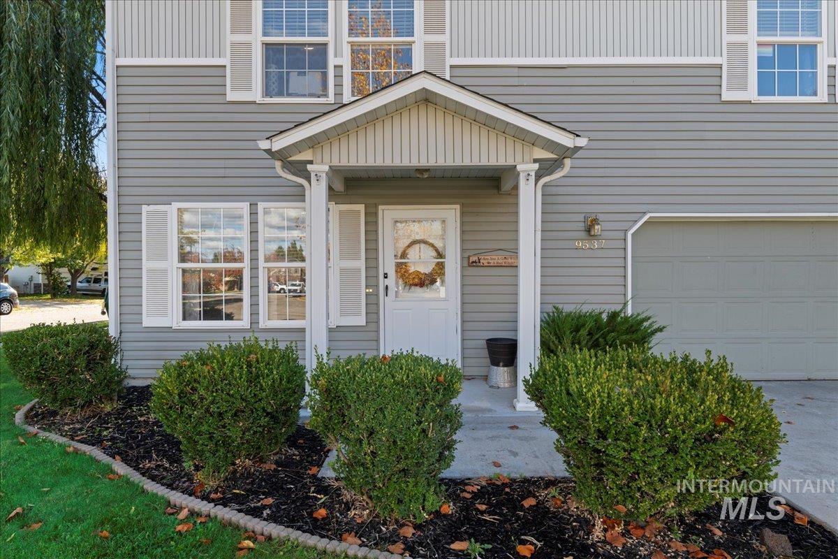 Entrance to property featuring a garage