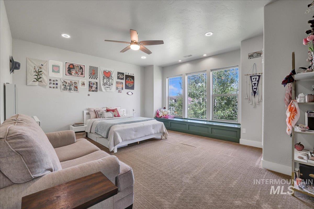 Bedroom featuring carpet floors, recessed lighting, and ceiling fan