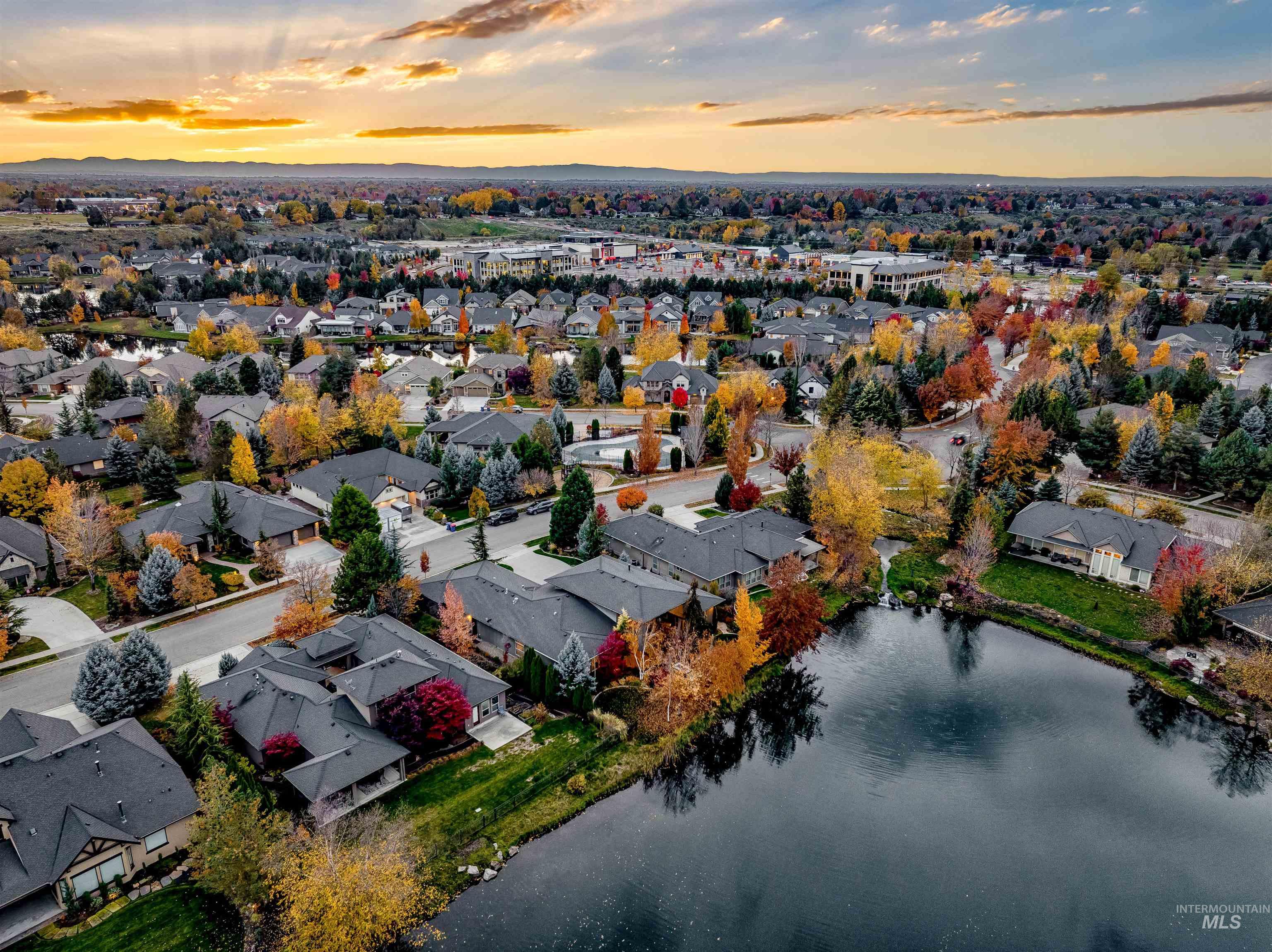 Aerial perspective of suburban area with a large body of water