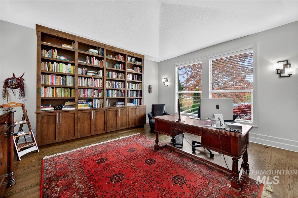 Office space featuring wood finished floors and baseboards