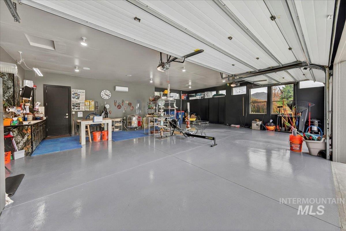 Garage featuring a garage door opener