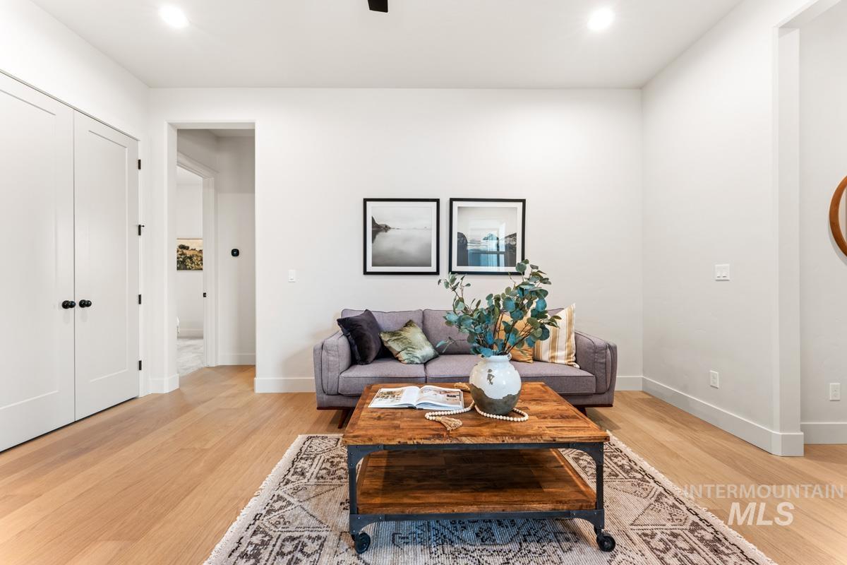 Bright interior space featuring light wood-finish flooring, recessed lighting, and a neutral color palette