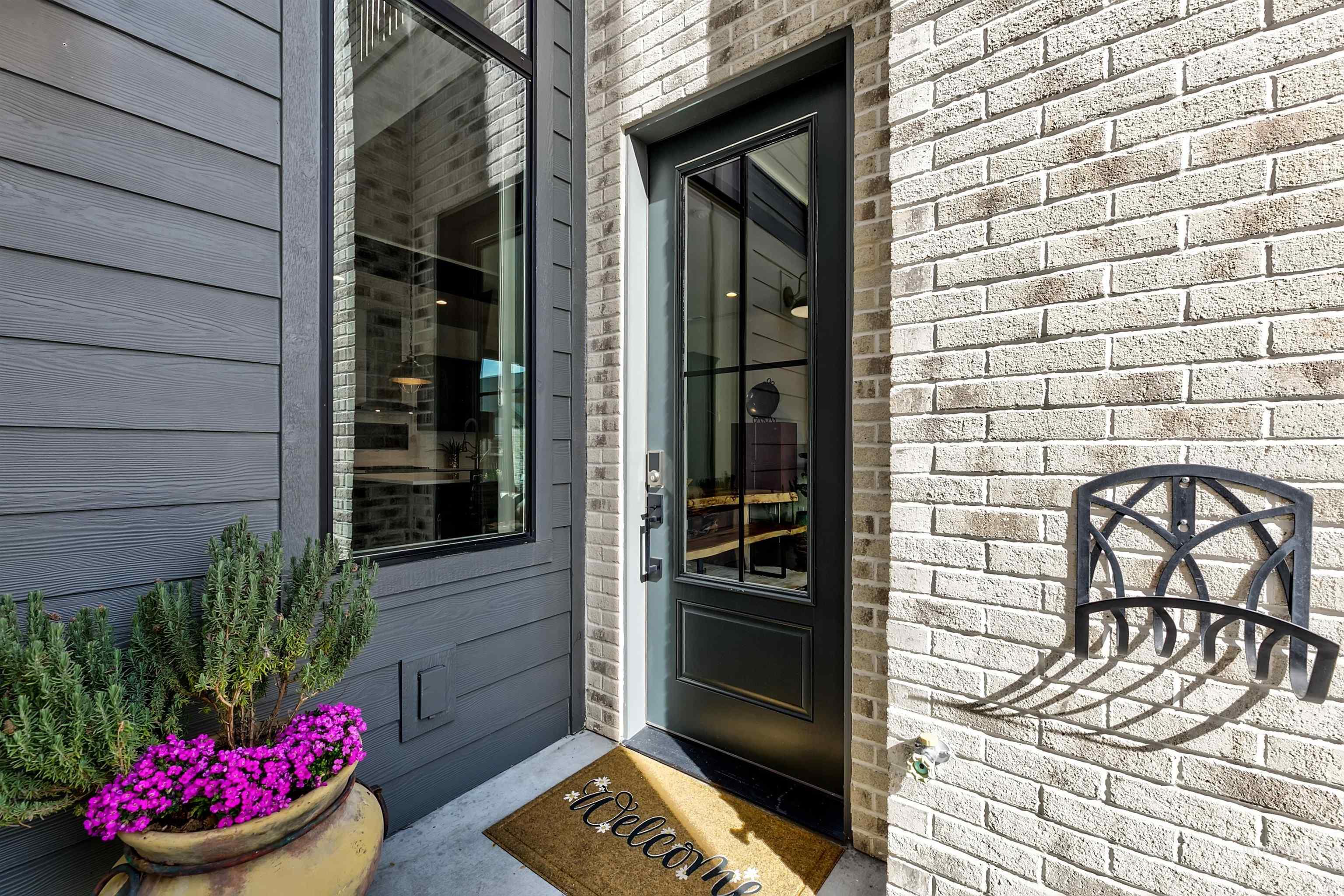 Entrance to property with brick siding