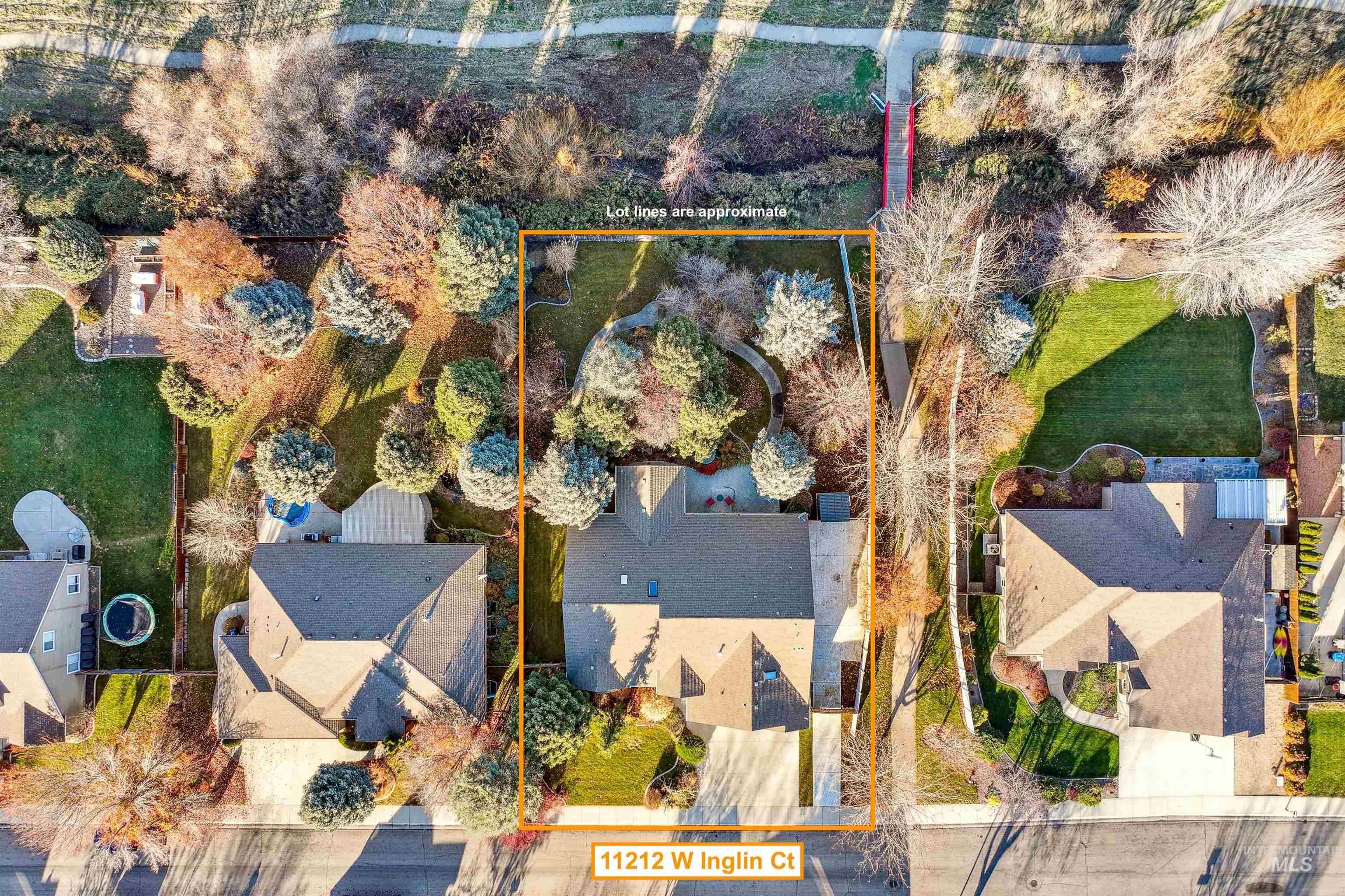 Aerial view of residential area with property boundaries highlighted