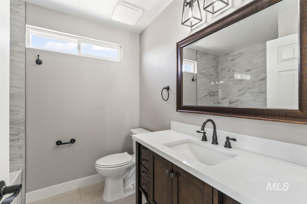 Full bathroom featuring vanity and a shower