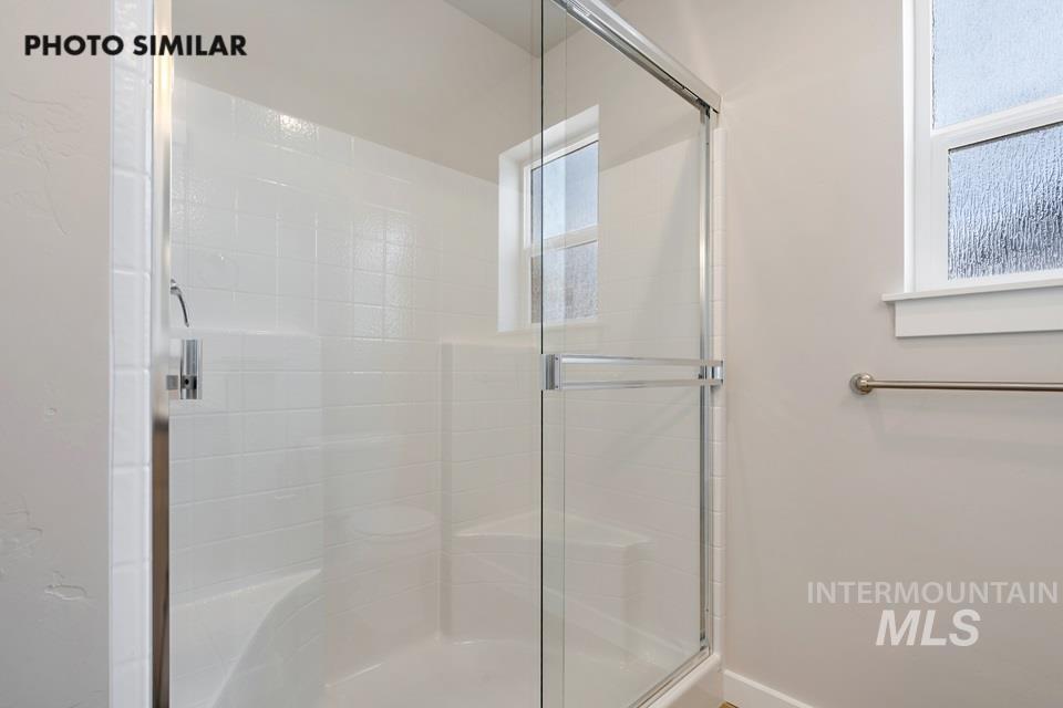 Full bath with a shower stall