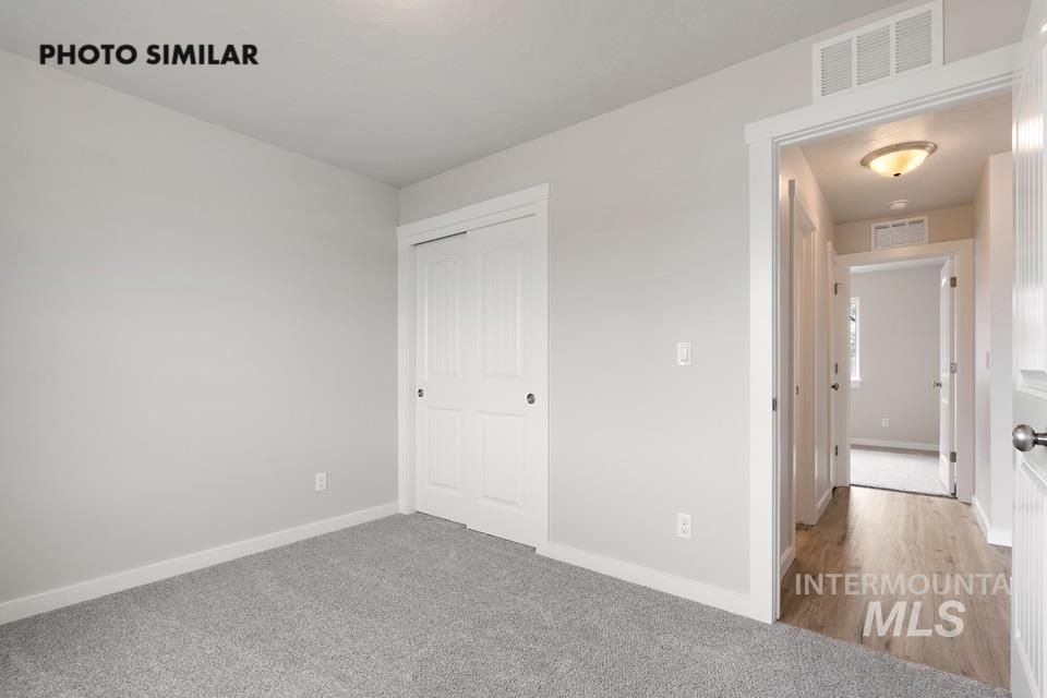 Unfurnished bedroom with carpet floors and a closet
