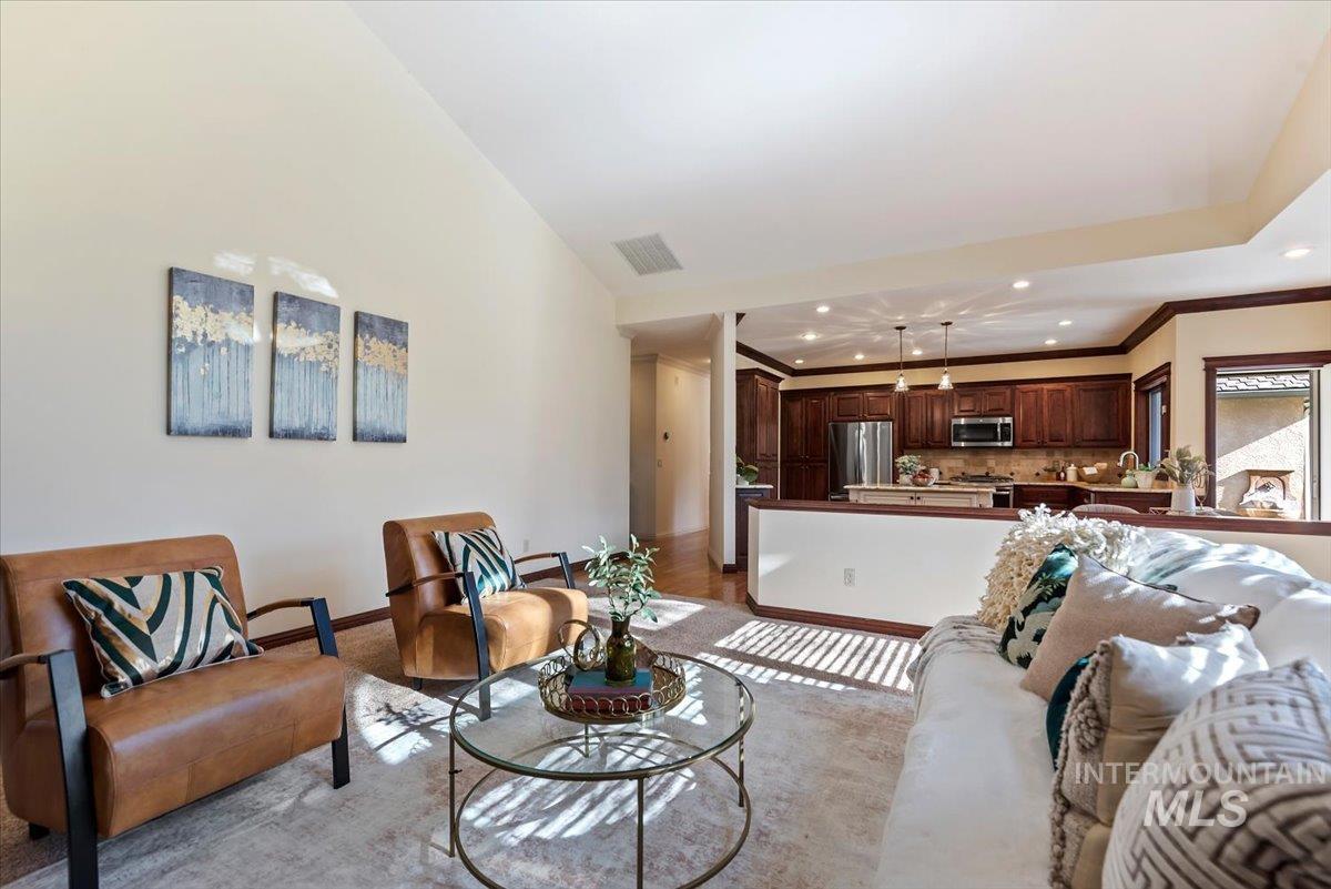 Living room featuring recessed lighting and crown molding