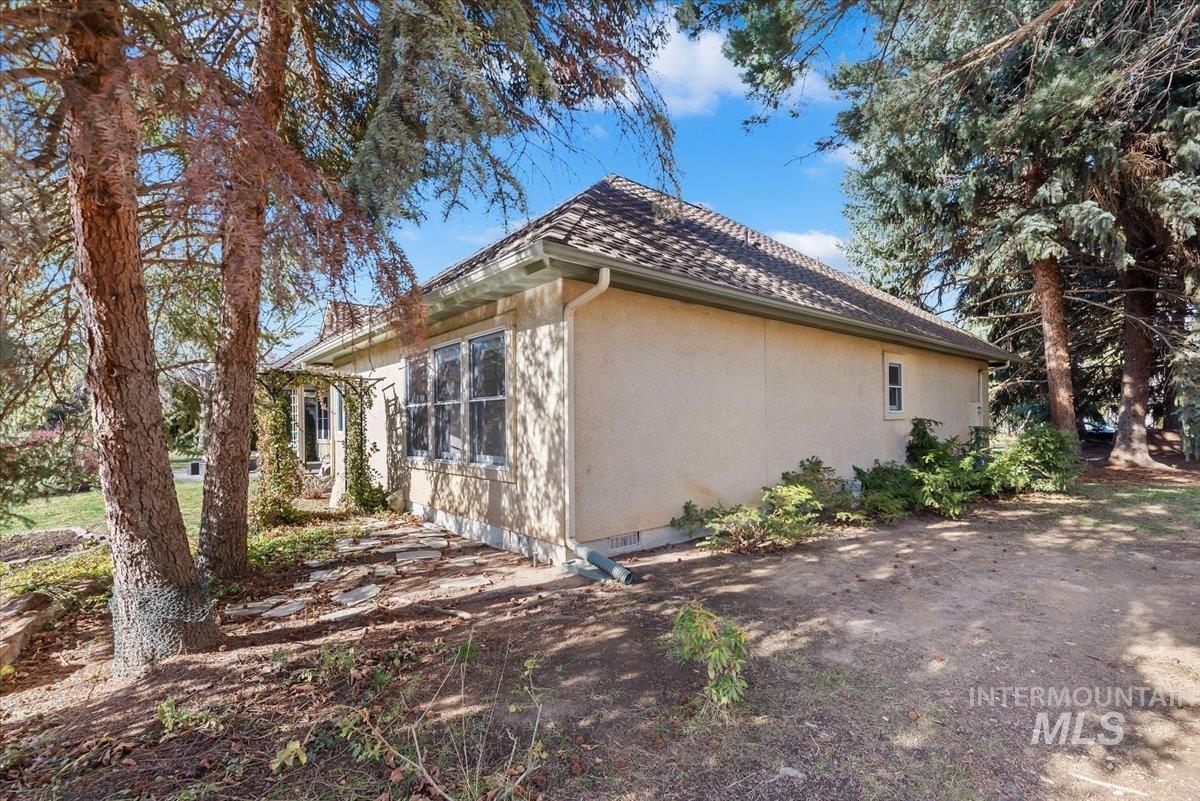 View of side of property with stucco siding