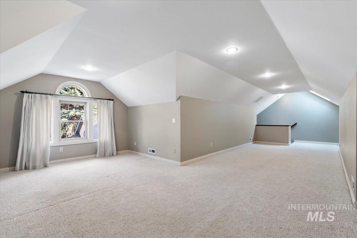 Bonus room with light carpet