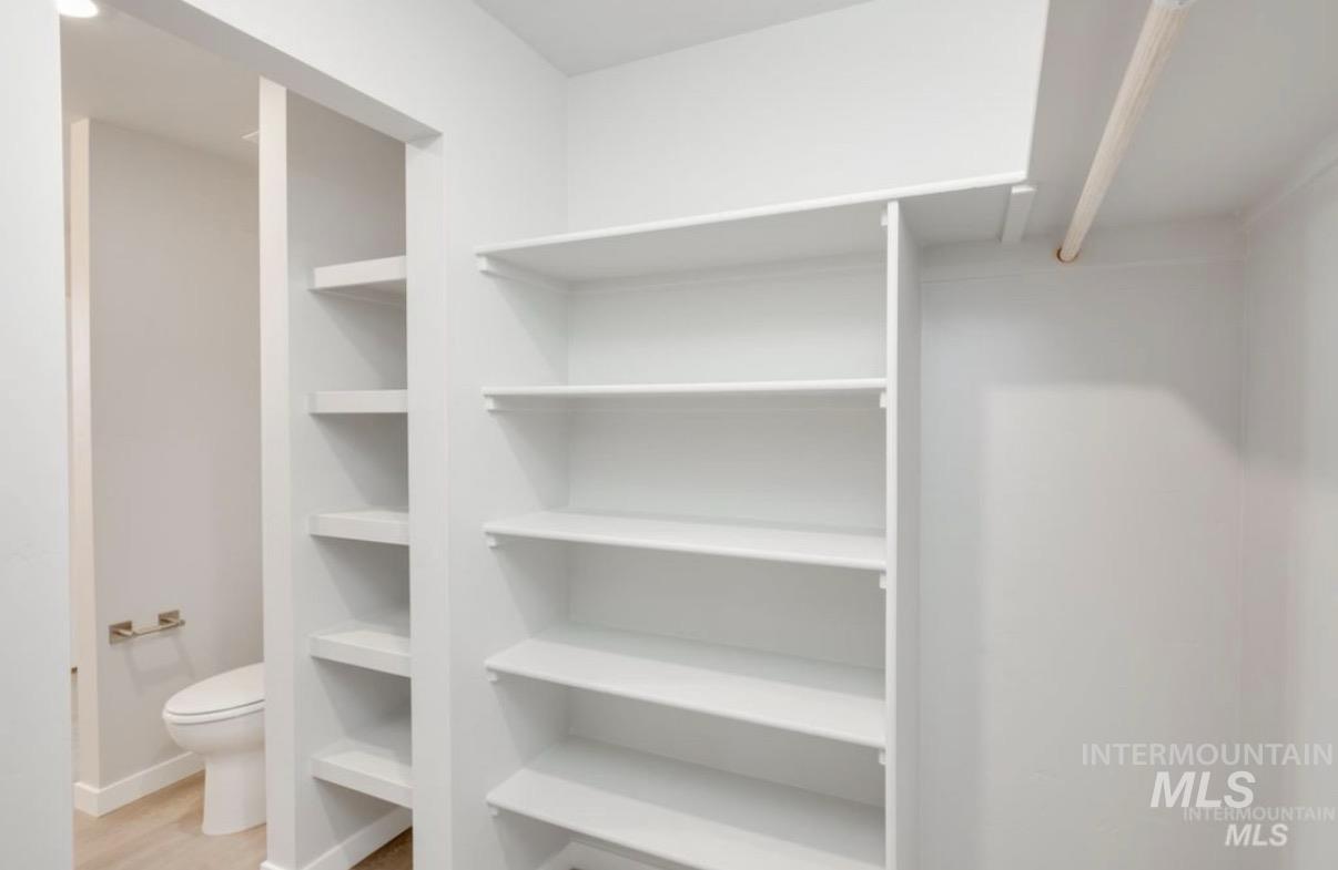 Walk in closet featuring light wood-style floors