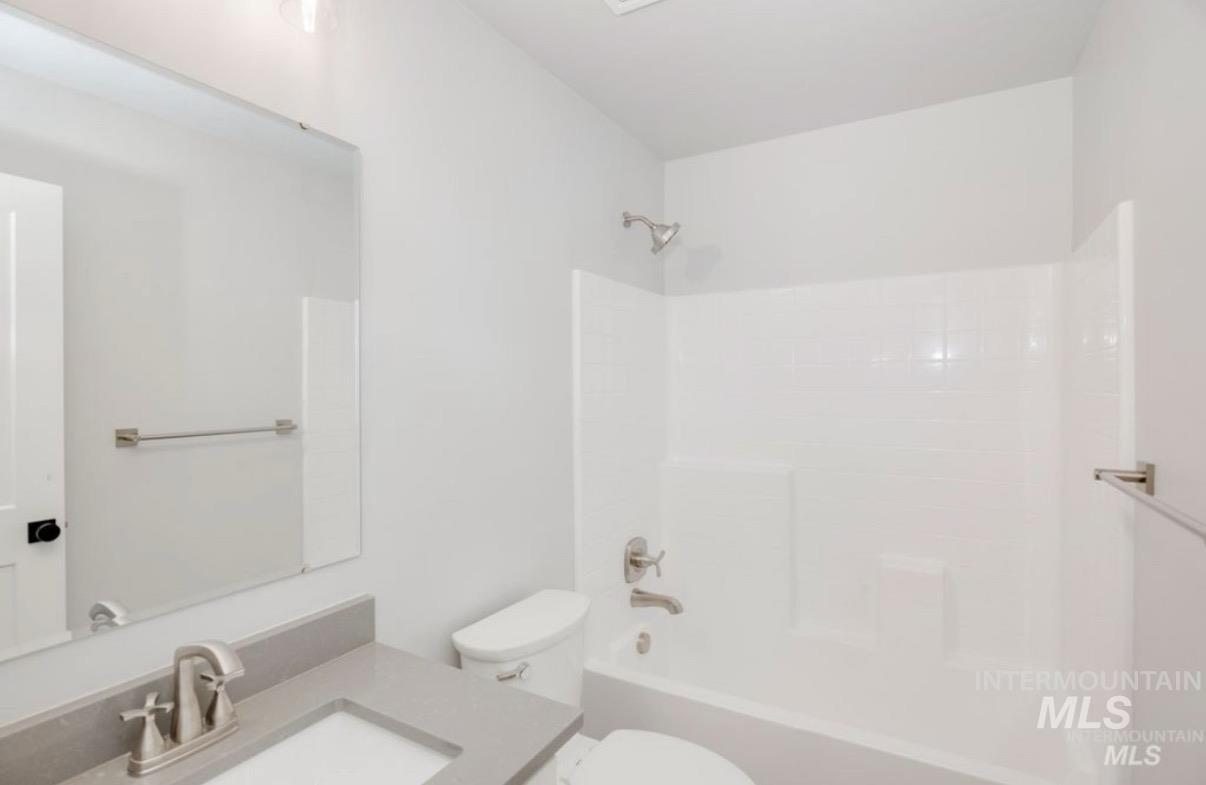 Bathroom featuring bathtub / shower combination and vanity