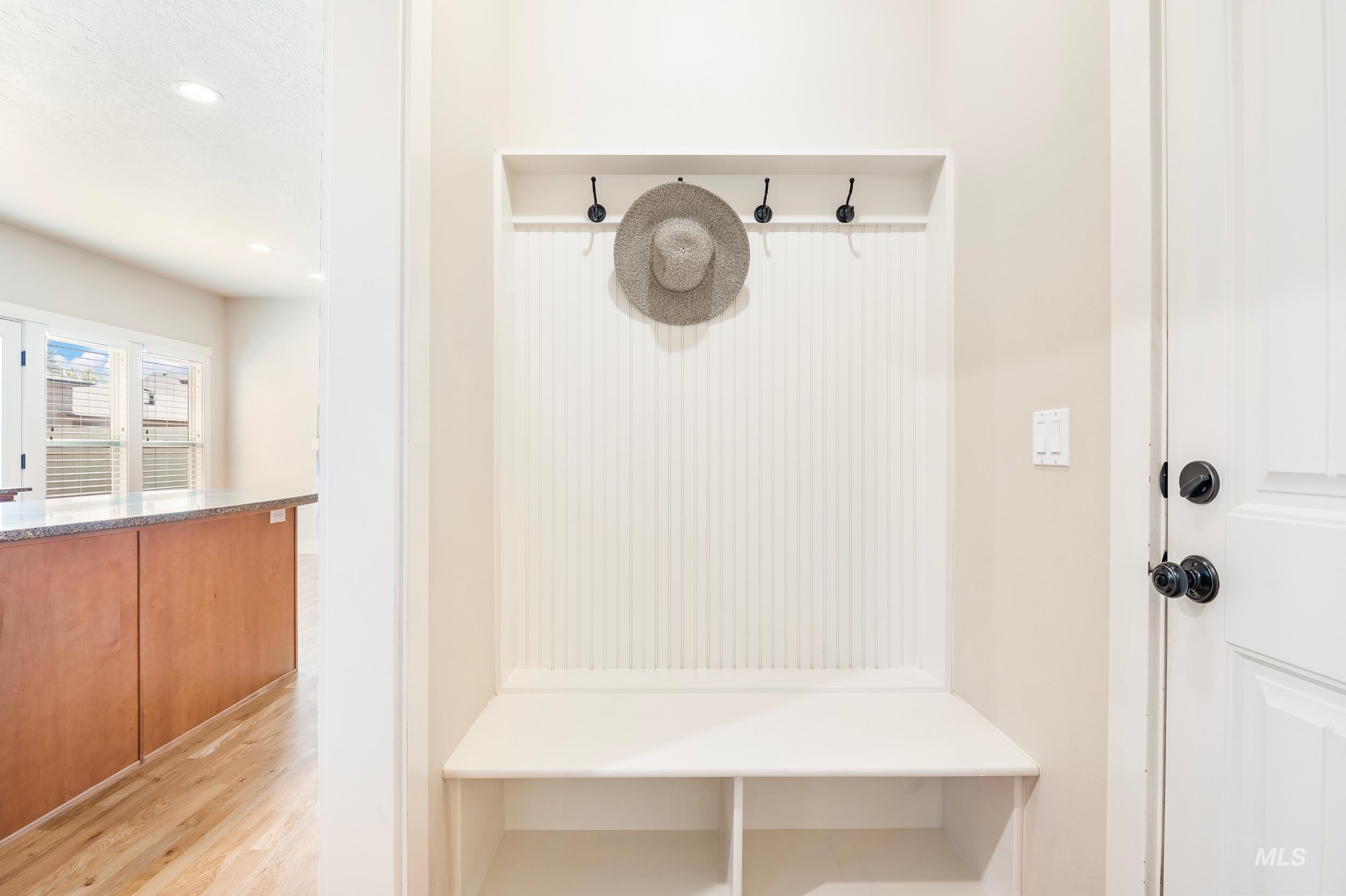 Mudroom featuring light wood finished floors and recessed lighting