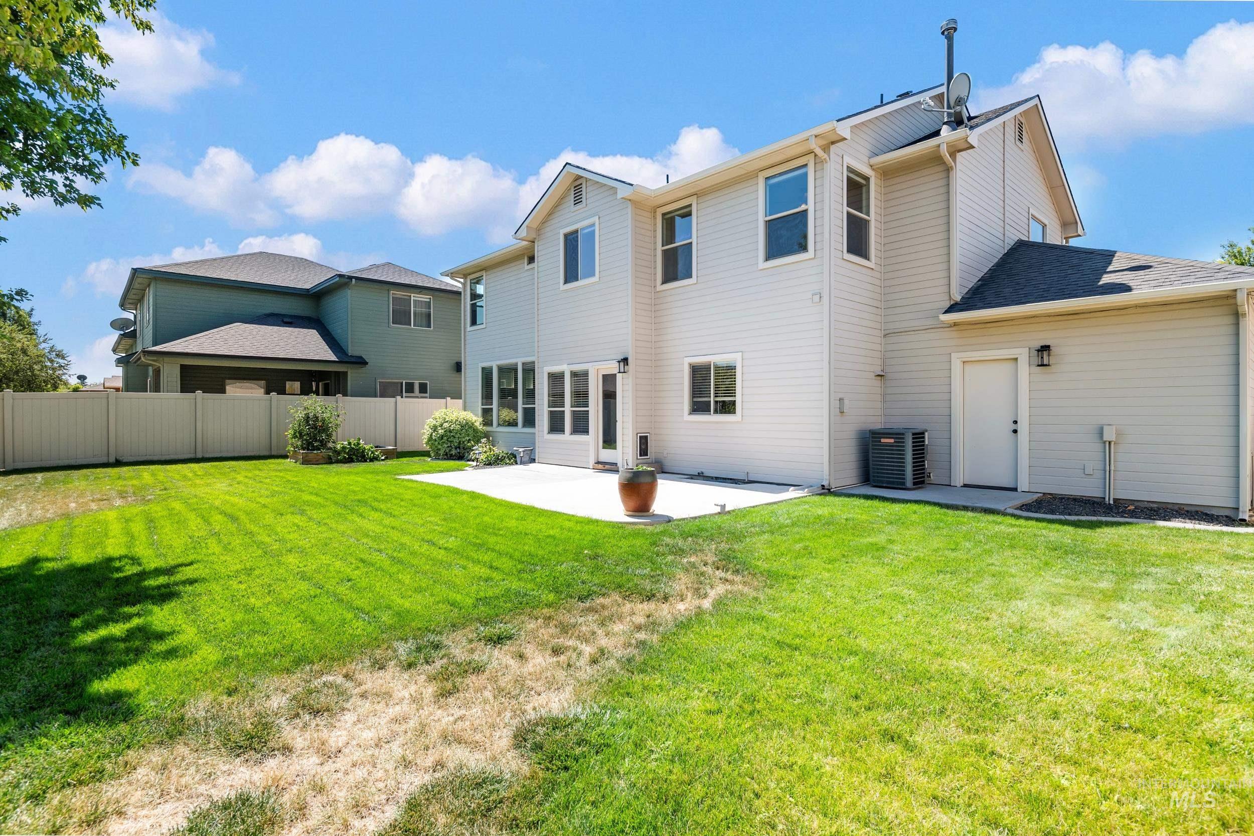 Rear view of house with a patio area