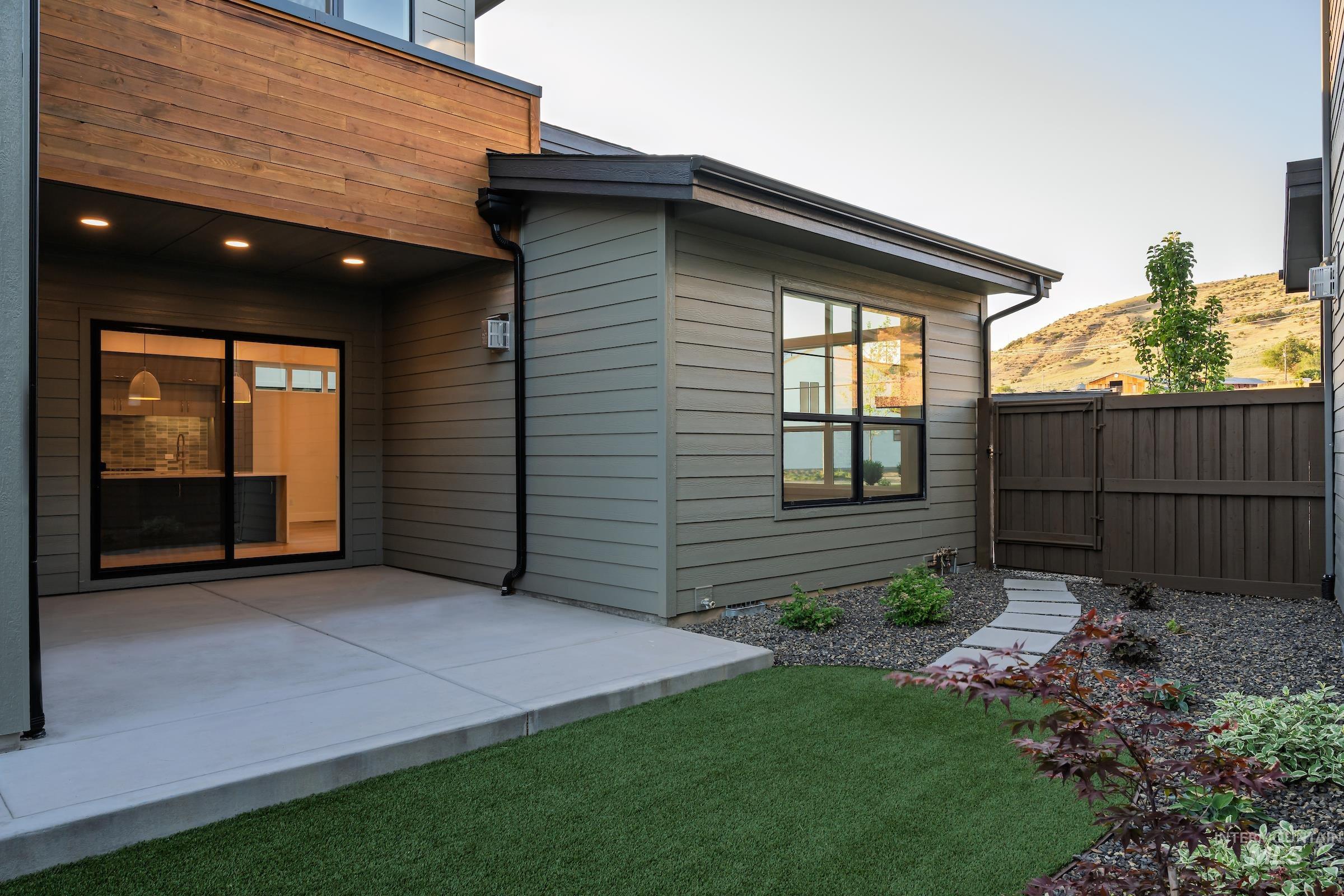 Back of house featuring a patio area and a mountain view