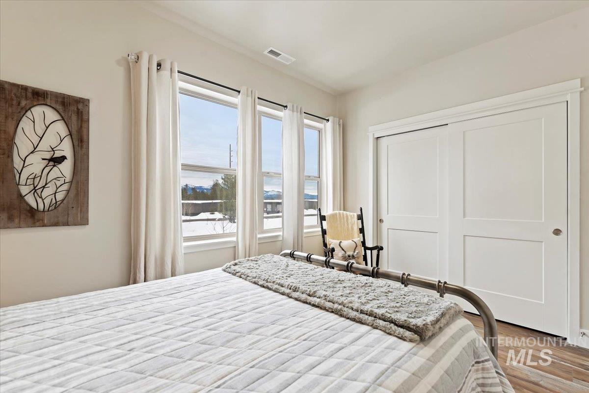 Bedroom featuring a closet and wood finished floors