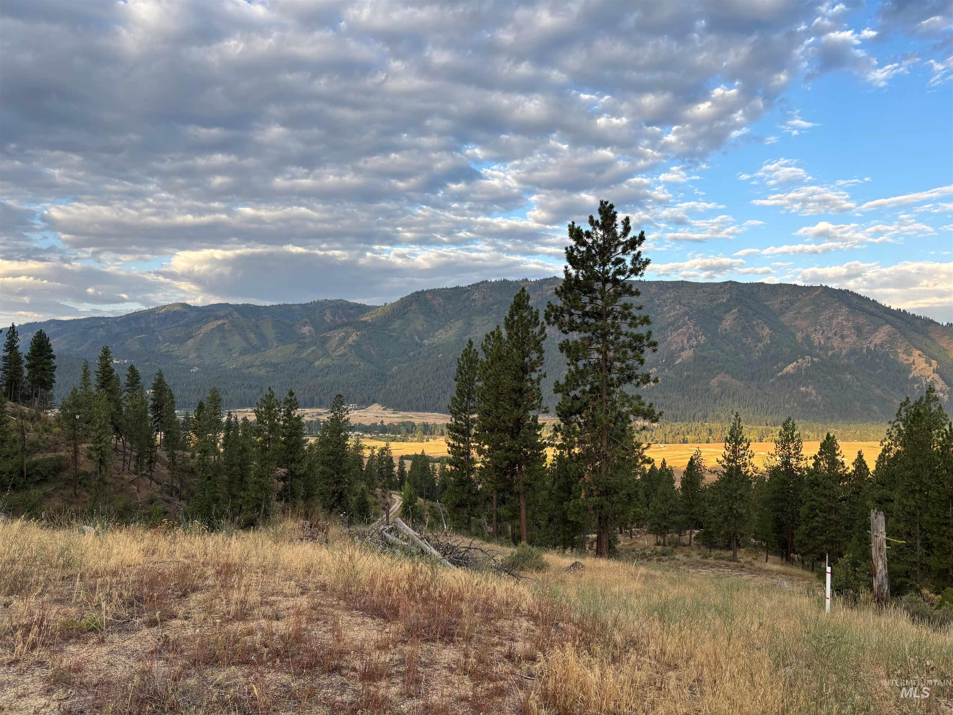 View of mountain background featuring rural landscape