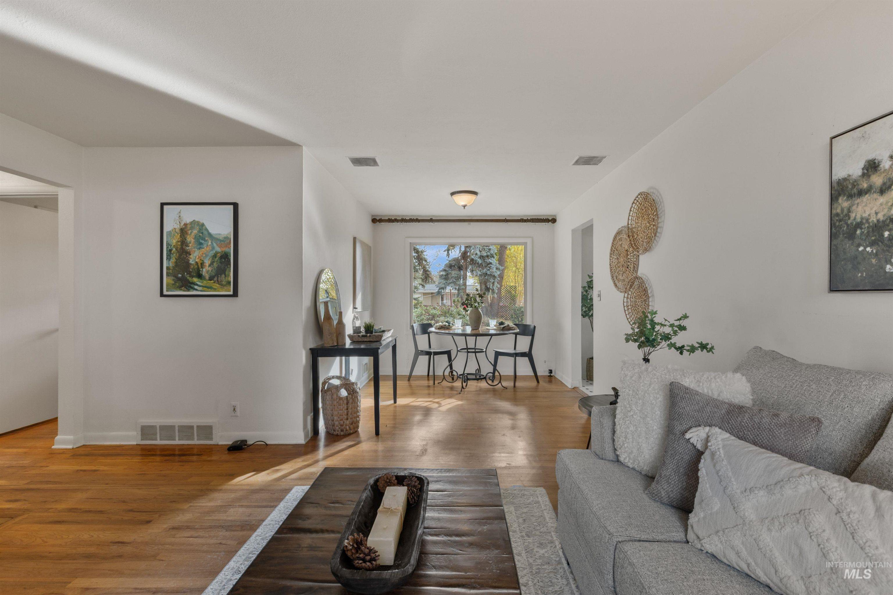 Living area featuring wood finished floors and baseboards