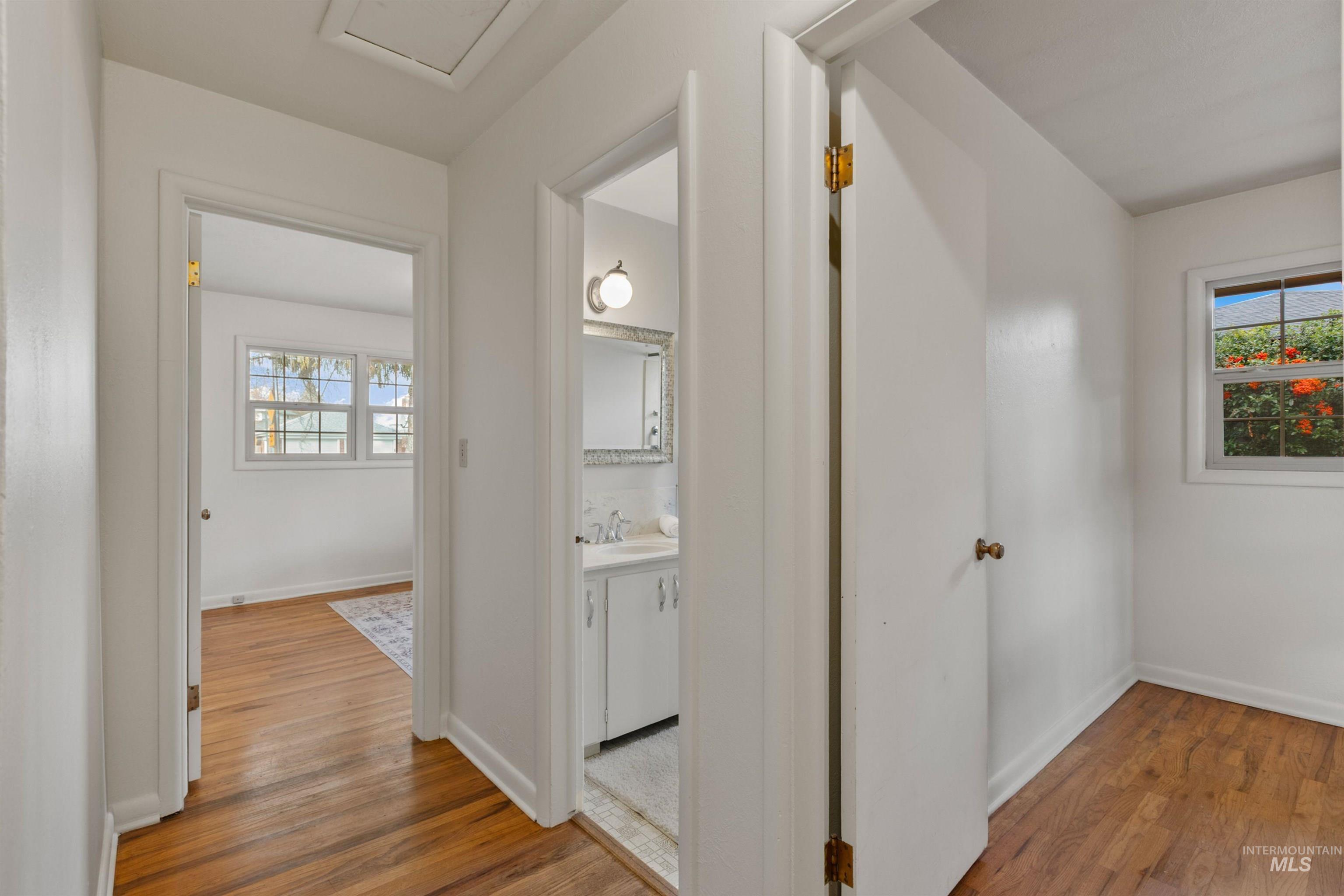 Hallway featuring light wood finished floors