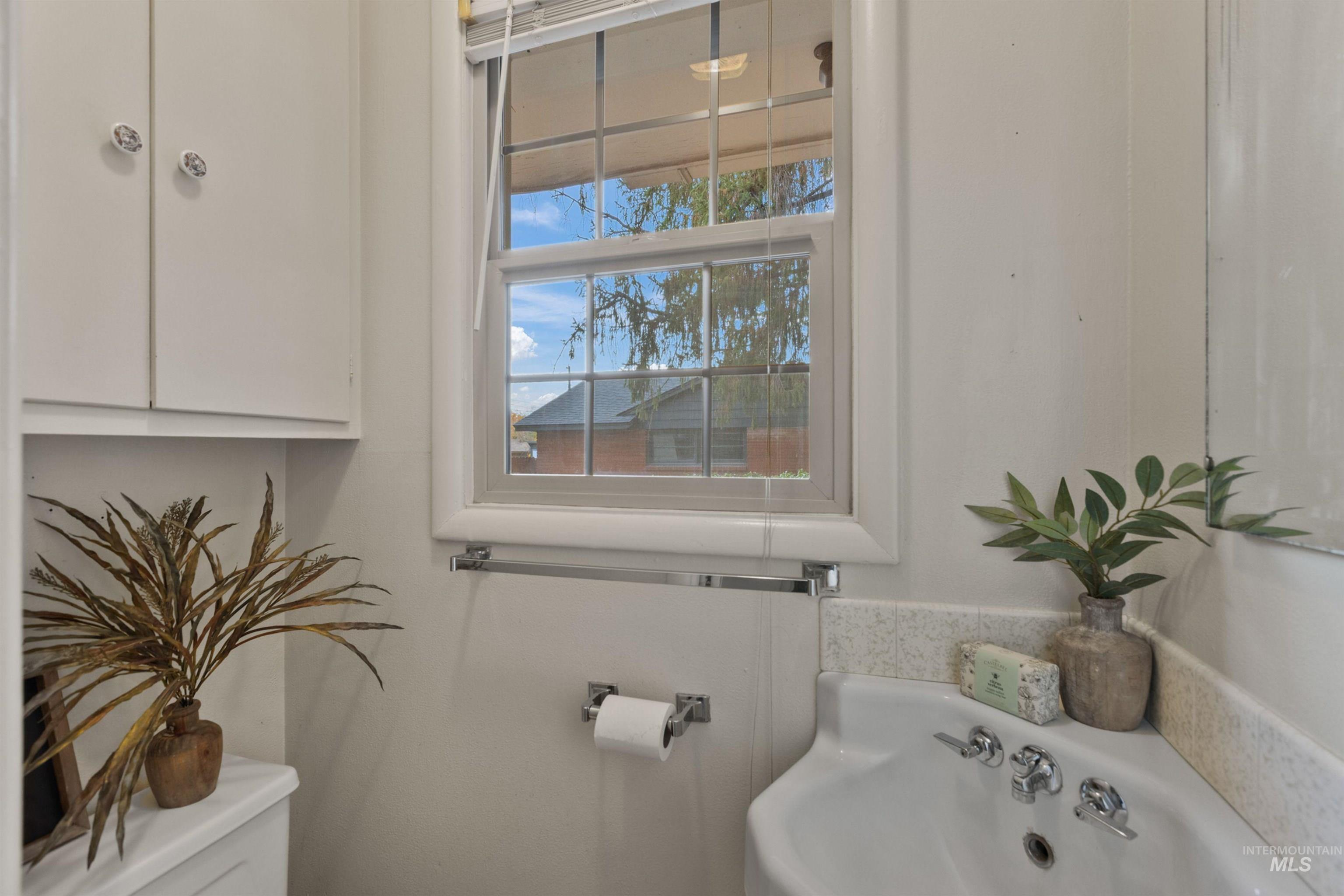 Bathroom featuring healthy amount of natural light