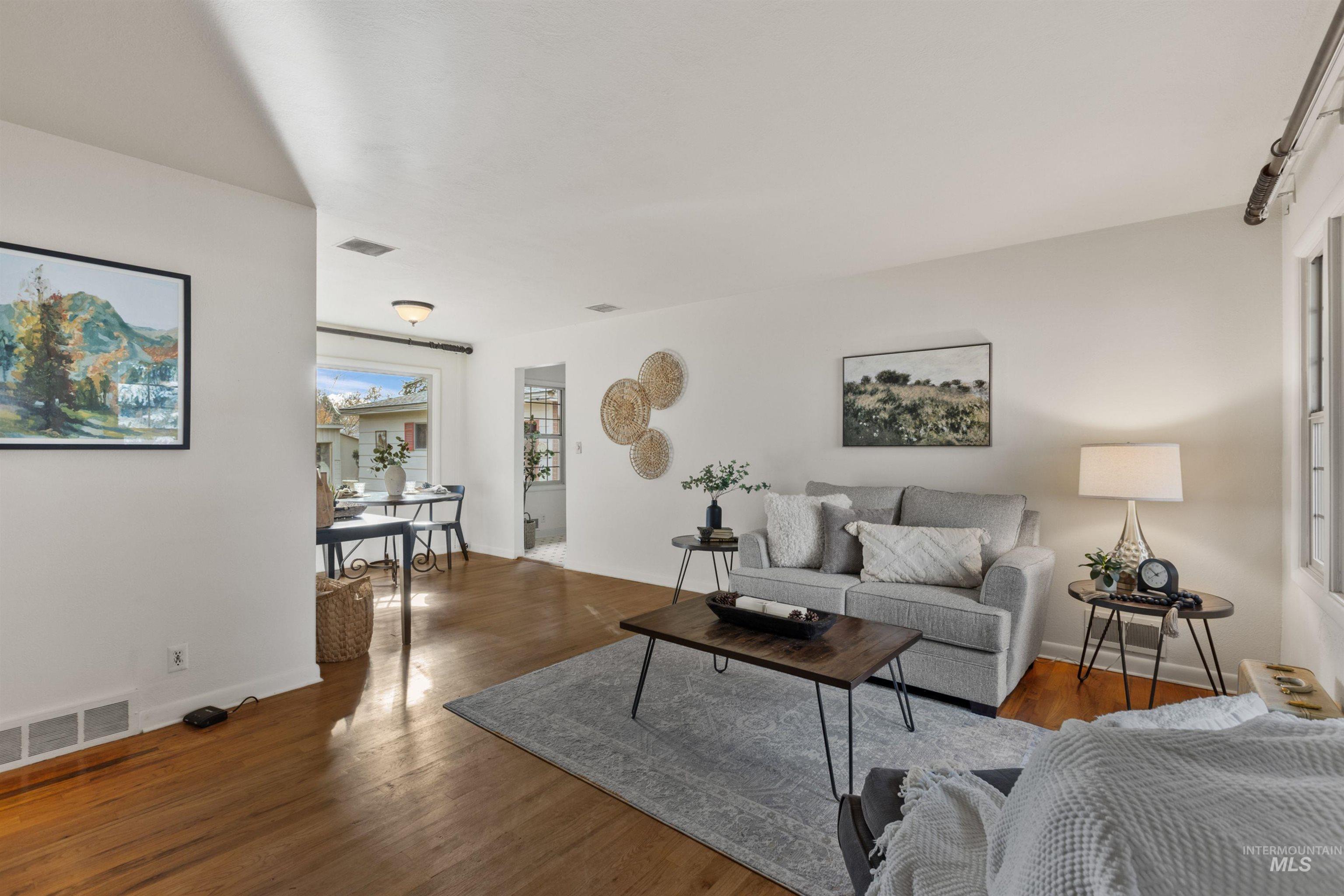 Living area featuring wood finished floors and baseboards