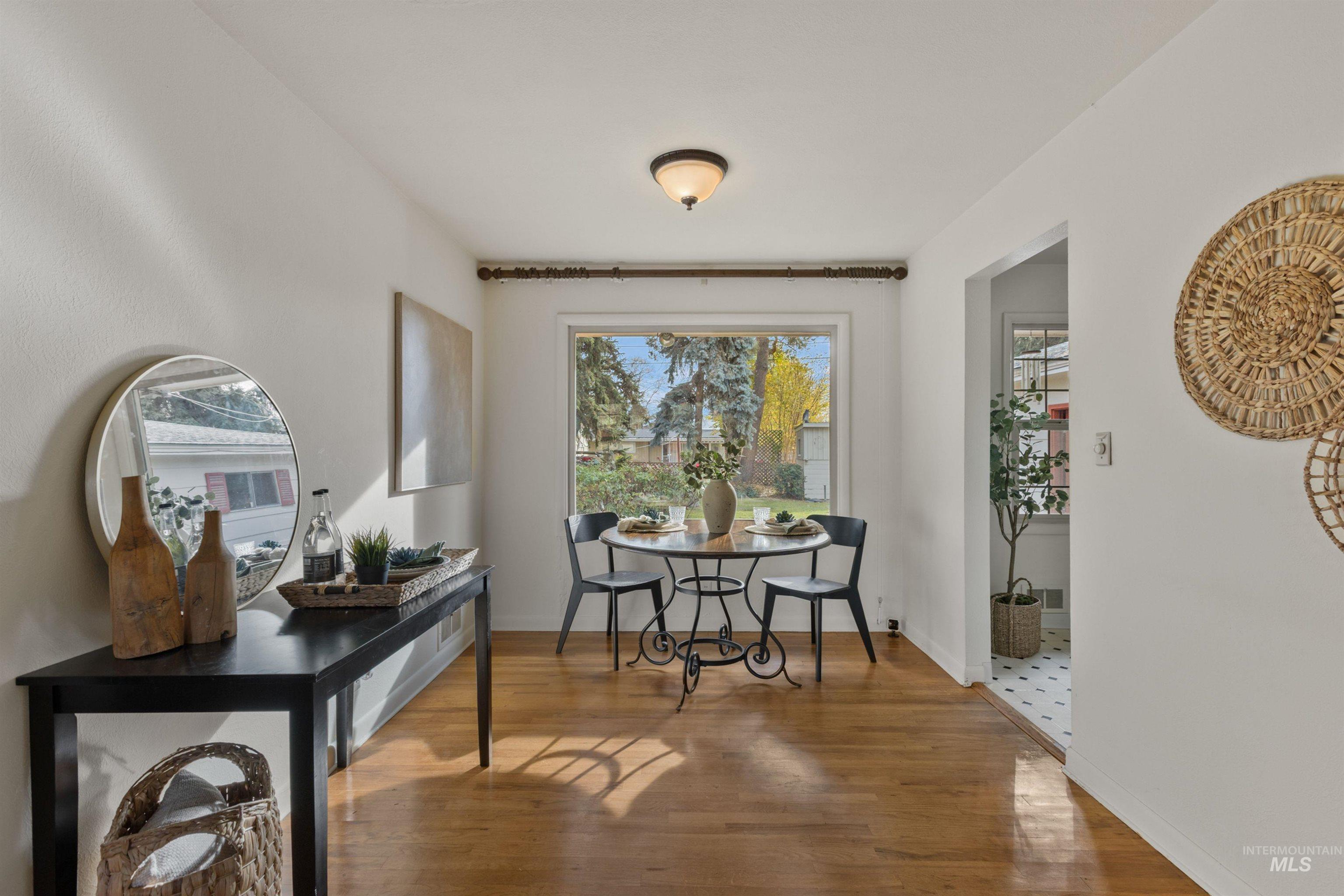 Dining room featuring wood finished floors and baseboards