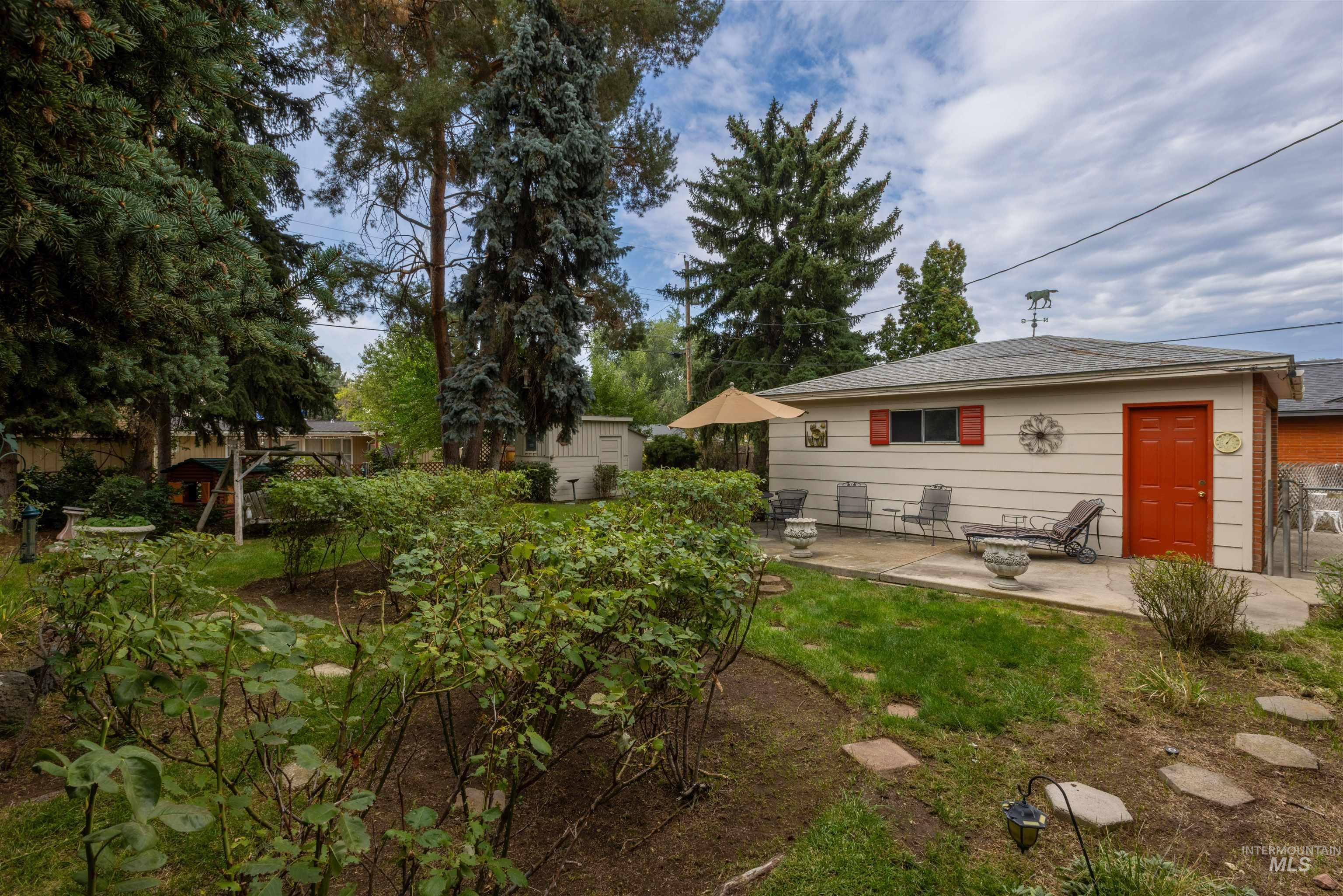 View of yard with a patio