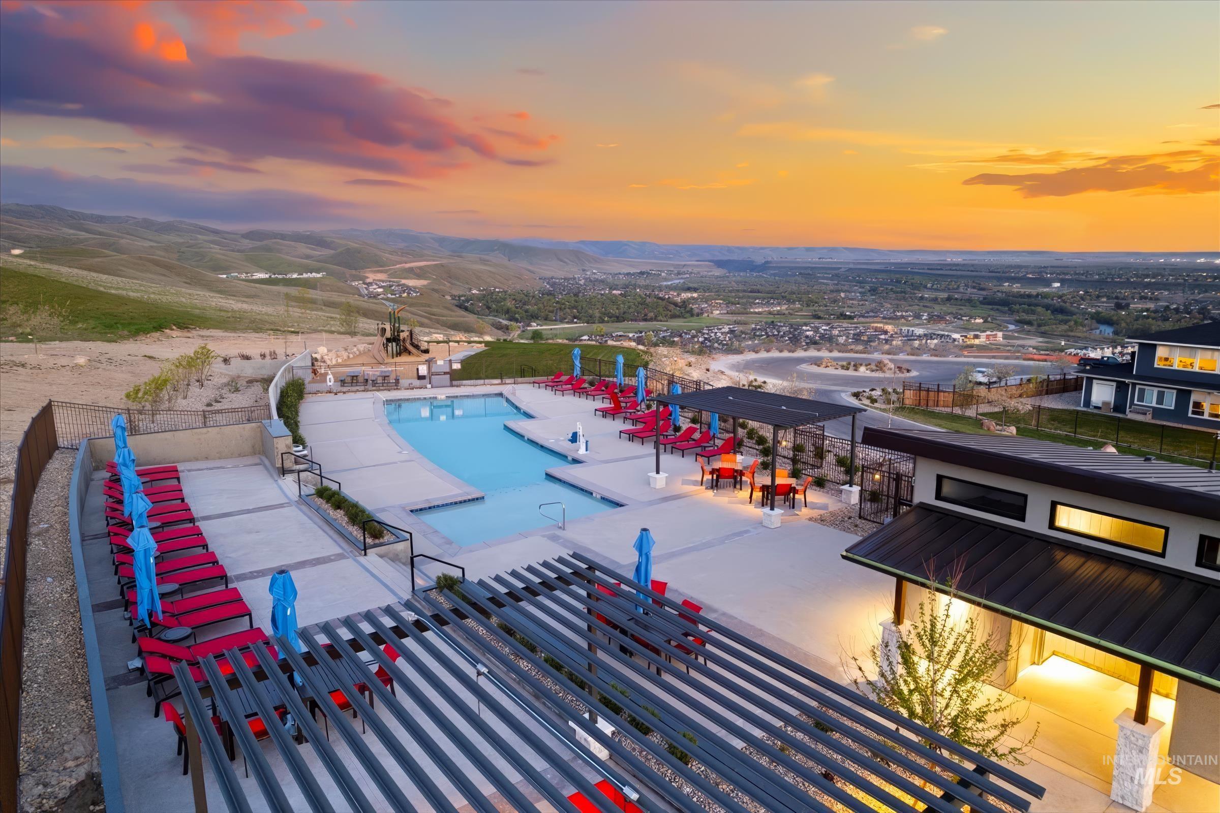 Community pool with a mountain view