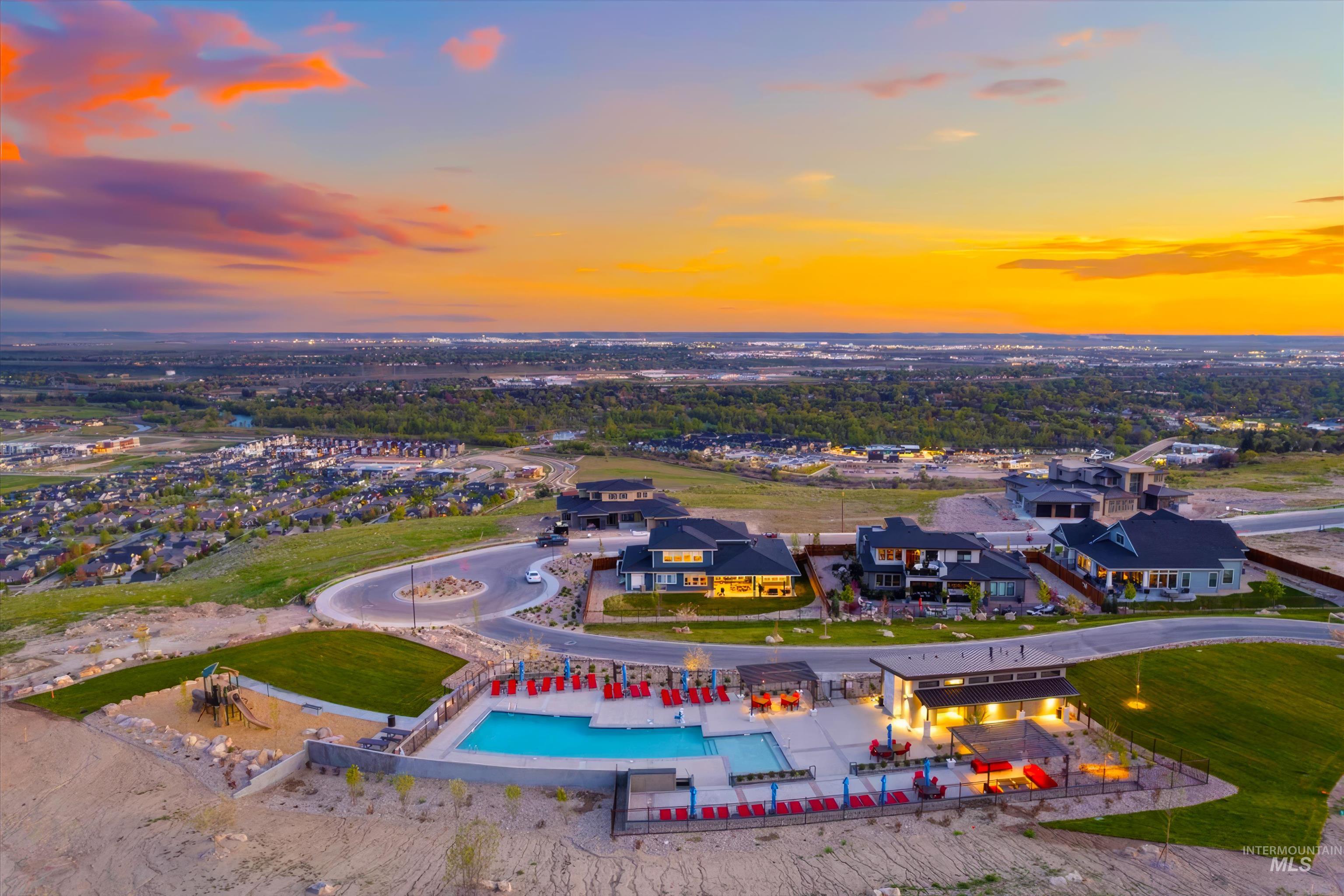 Aerial perspective of suburban area featuring a pool area