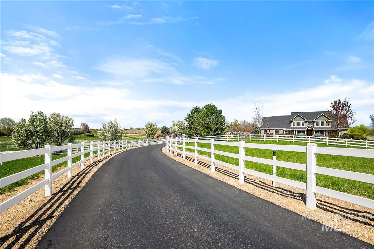 View of asphalt road featuring a view of countryside