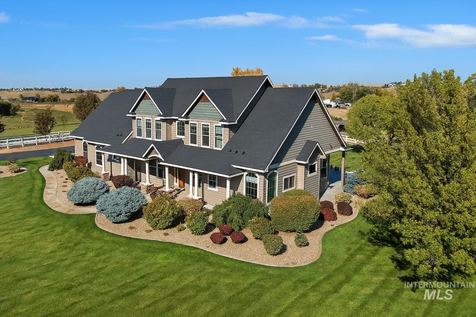 Back of property with a porch and a yard