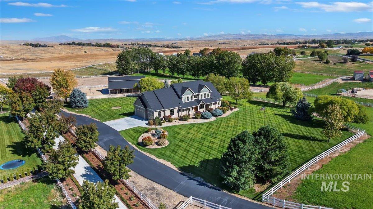Overview of rural landscape featuring a mountainous background