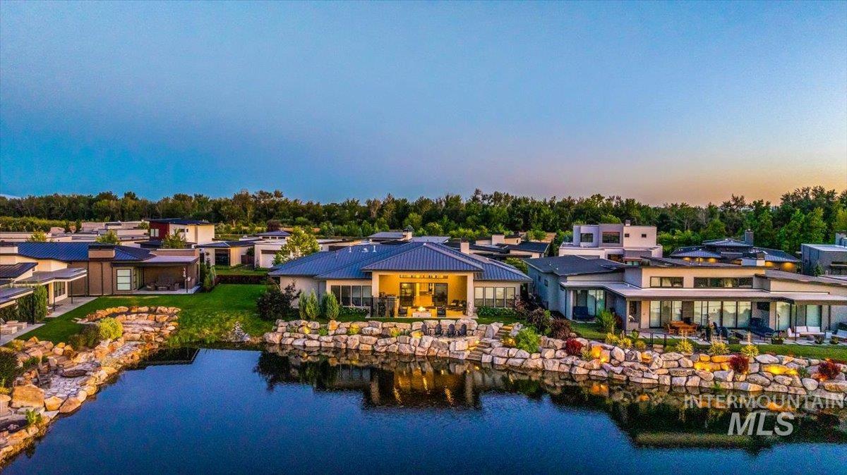 Back of property featuring a water view