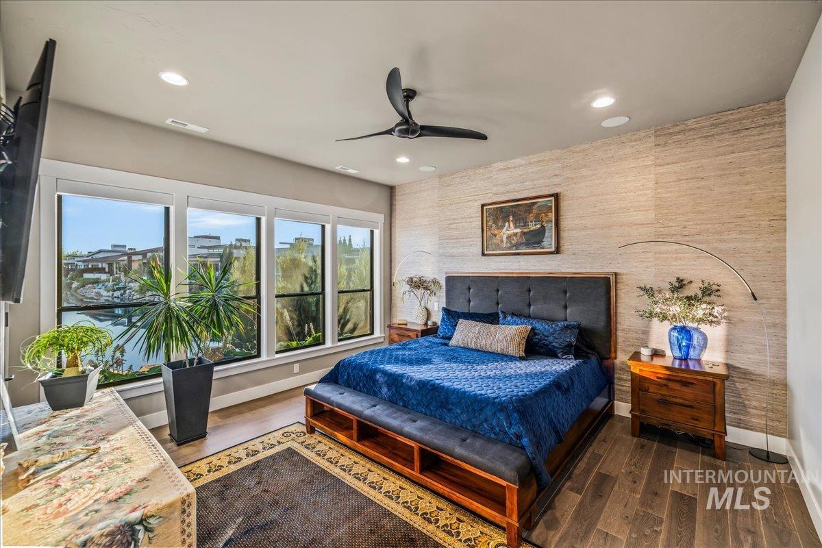 Bedroom with recessed lighting, wood finished floors, and a ceiling fan