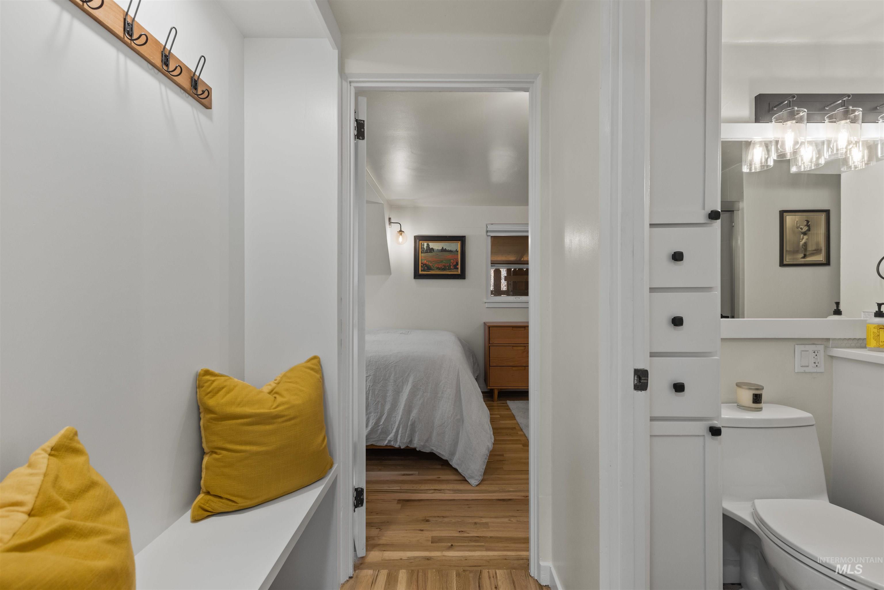 Bathroom featuring light wood-style flooring and connected bathroom