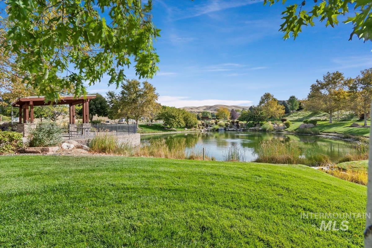 View of grassy yard featuring a water view