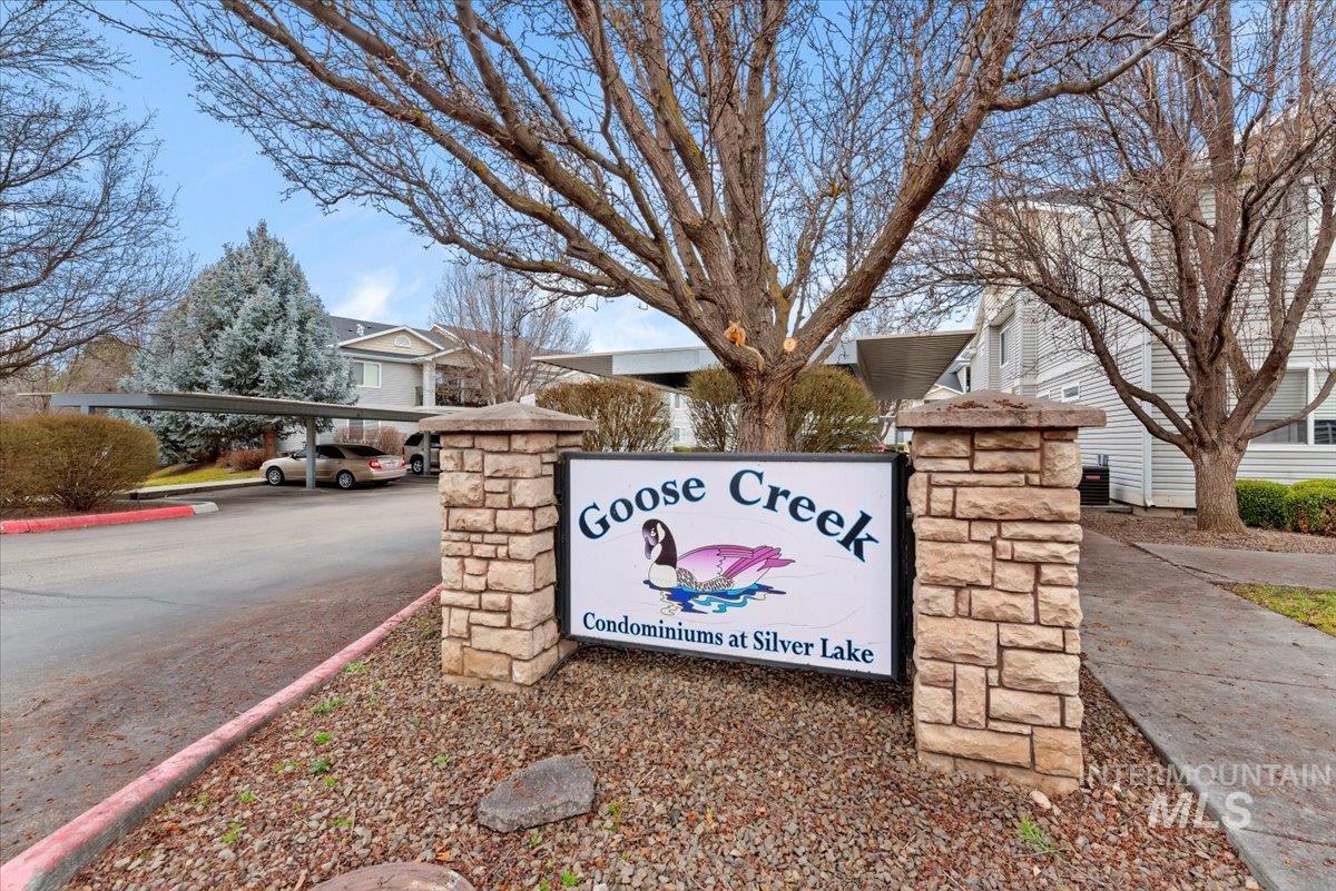 Community sign with covered and uncovered parking