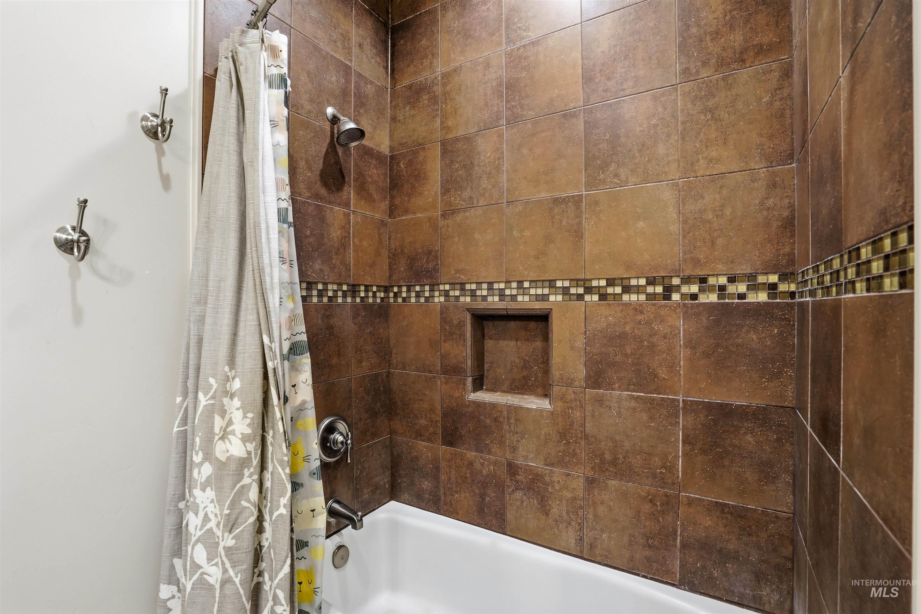 Full bath featuring shower / bath combination with curtain