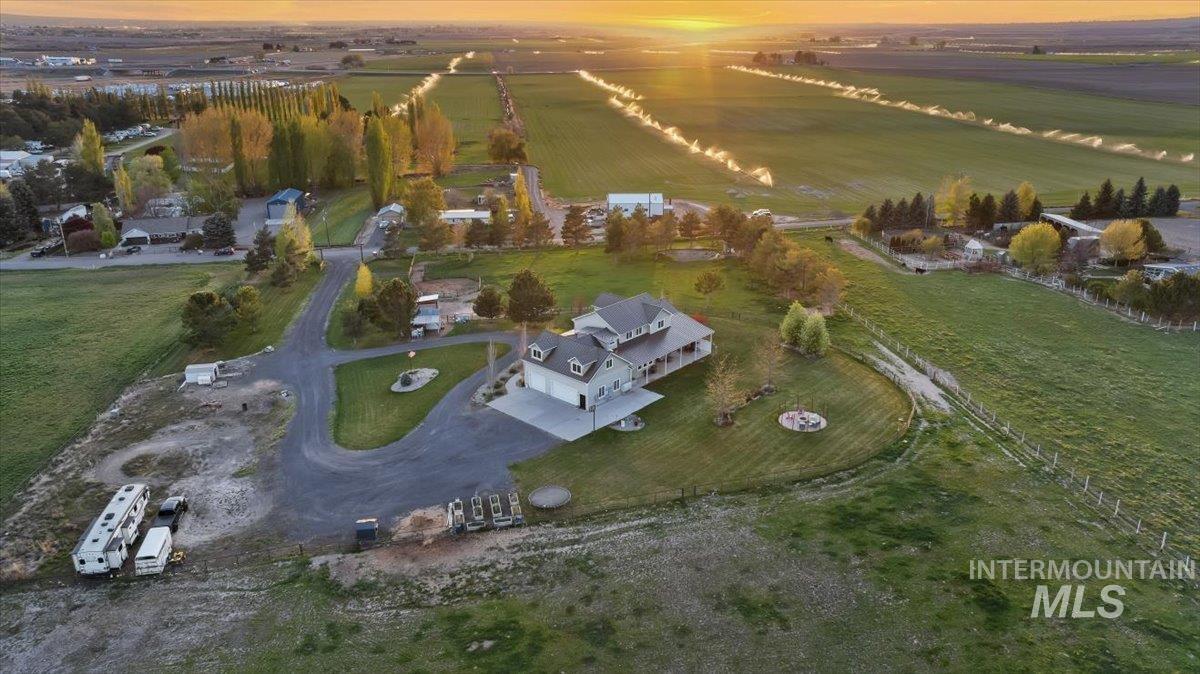 Aerial view of property and surrounding area with rural landscape and abundant farmland