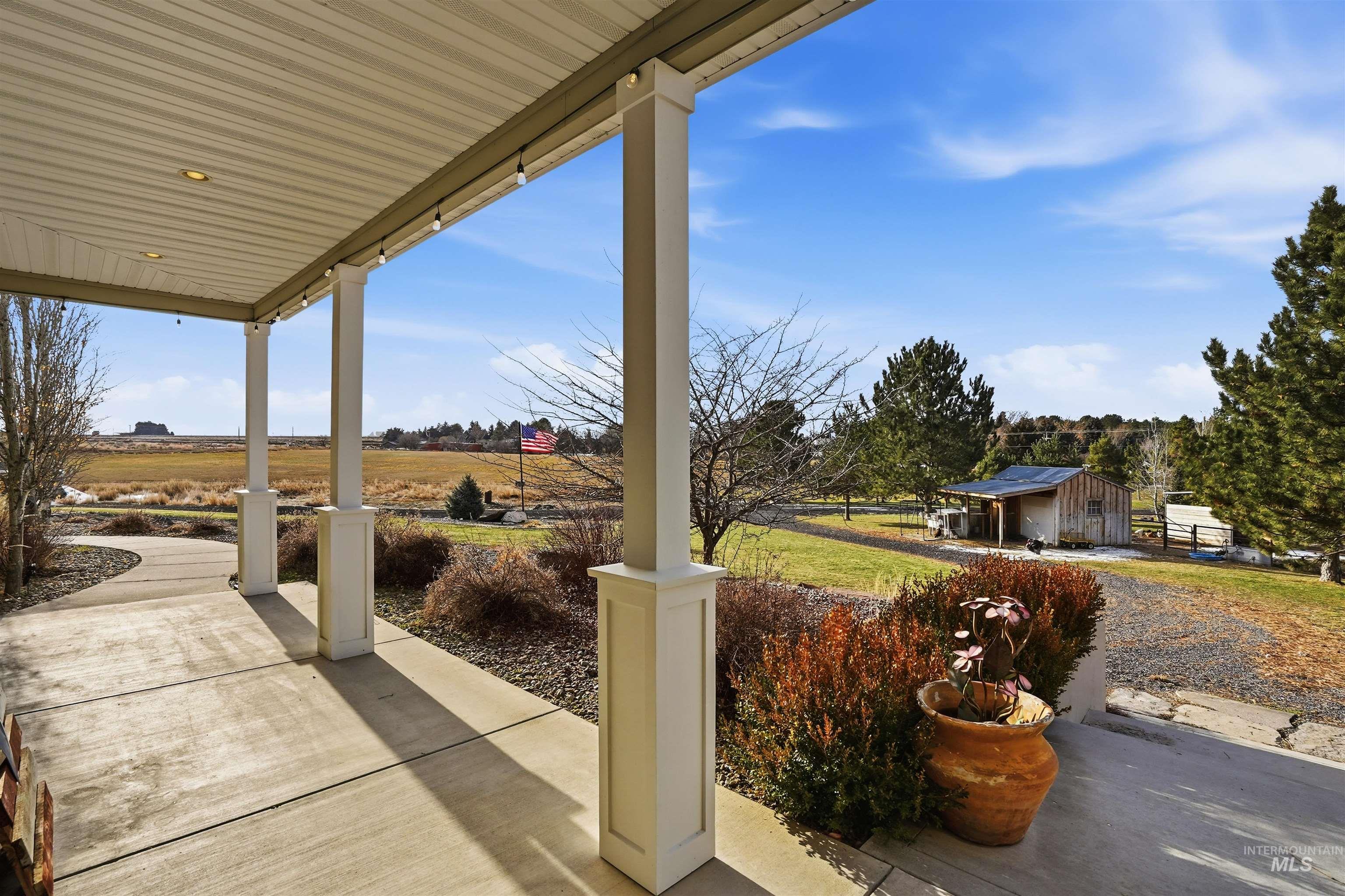 Covered porch with an outbuilding