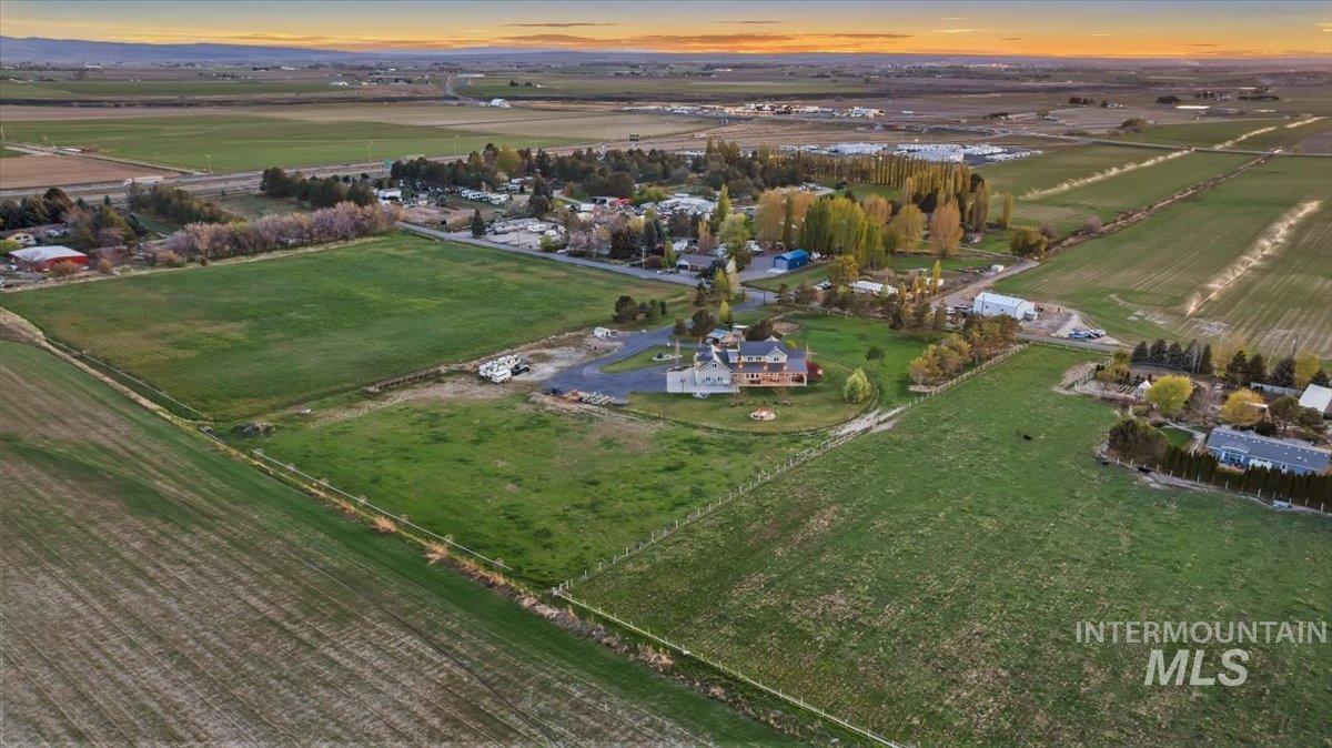 Aerial view at dusk of a view of rural / pastoral area and agricultural plots