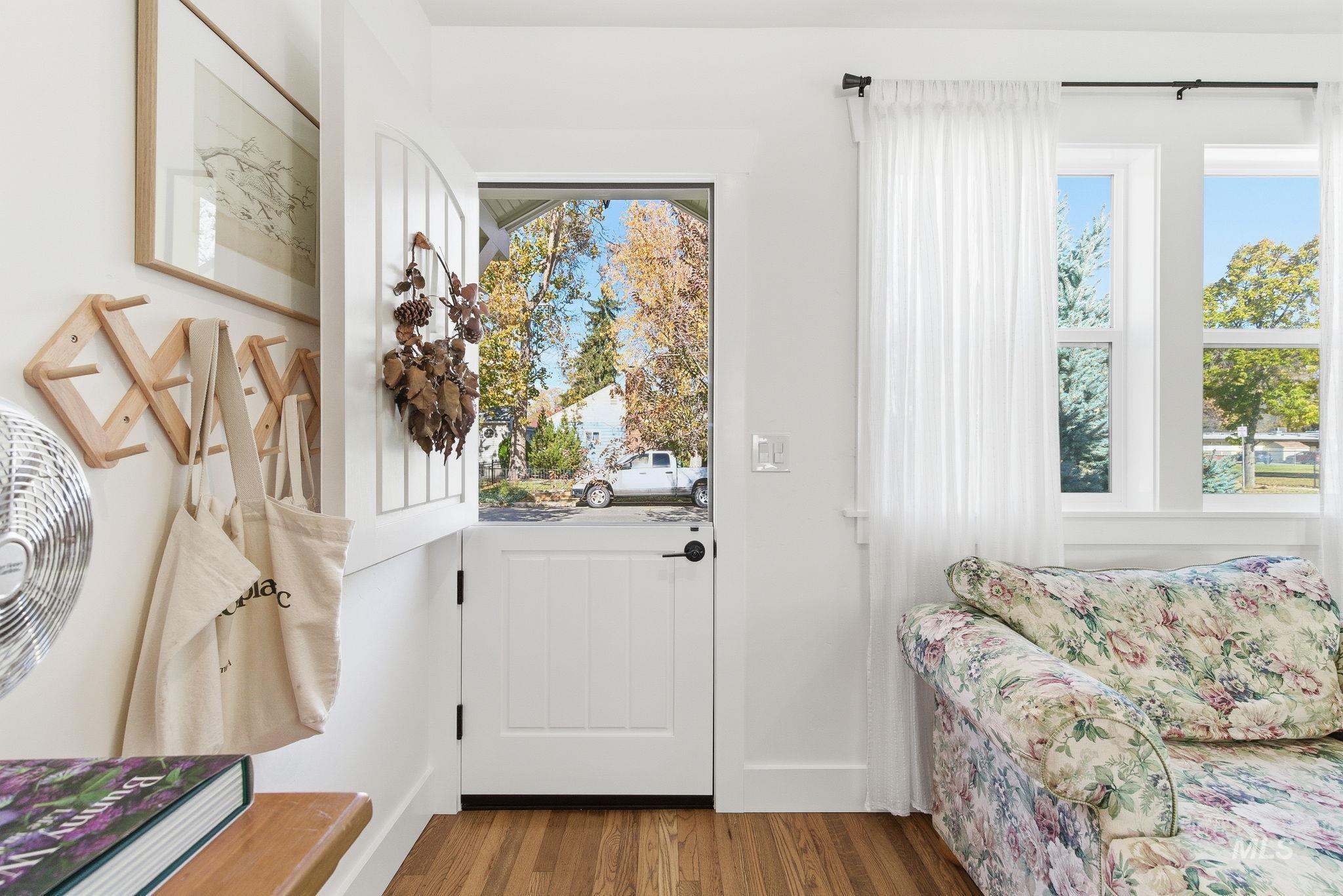 Doorway featuring wood finished floors