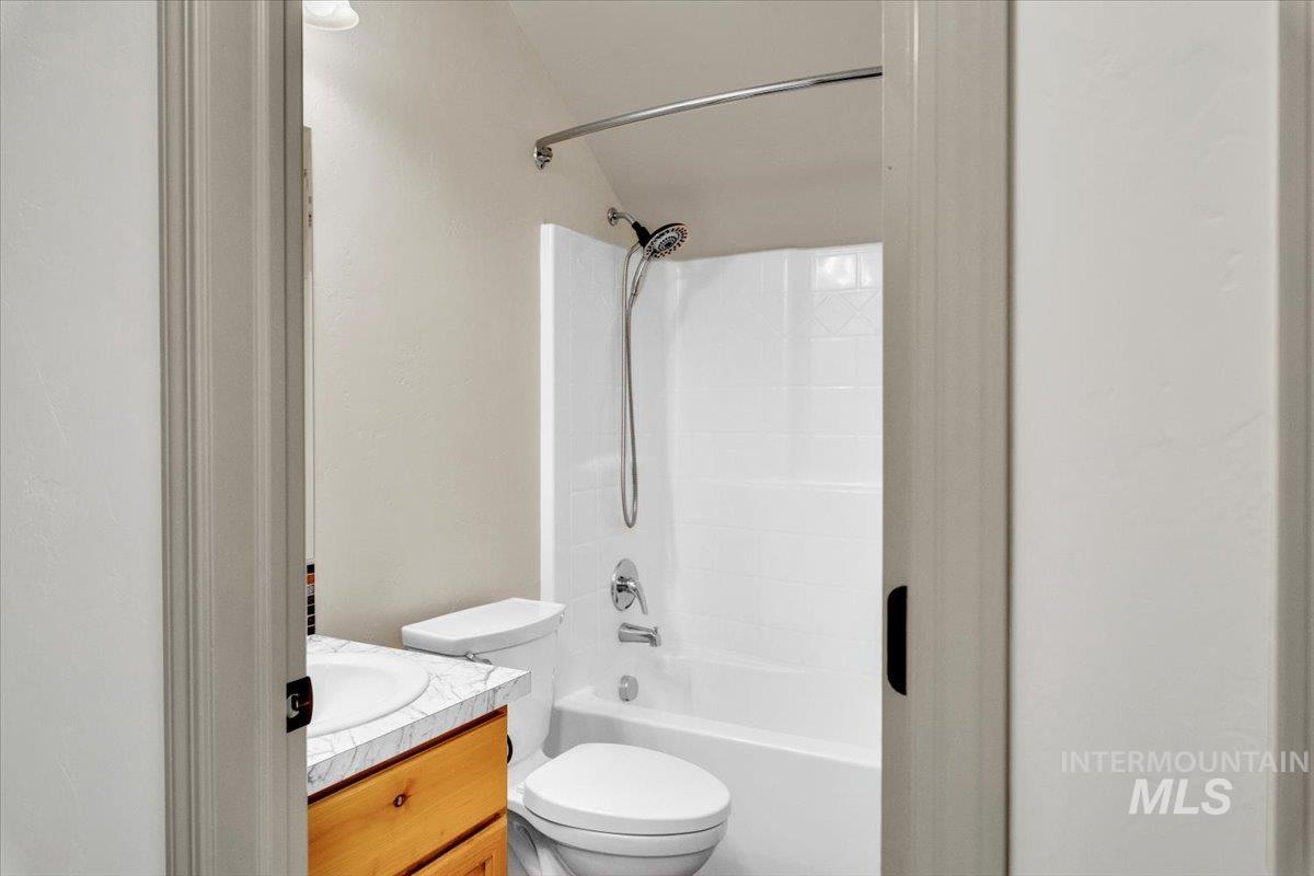Full bathroom with vanity and  shower combination