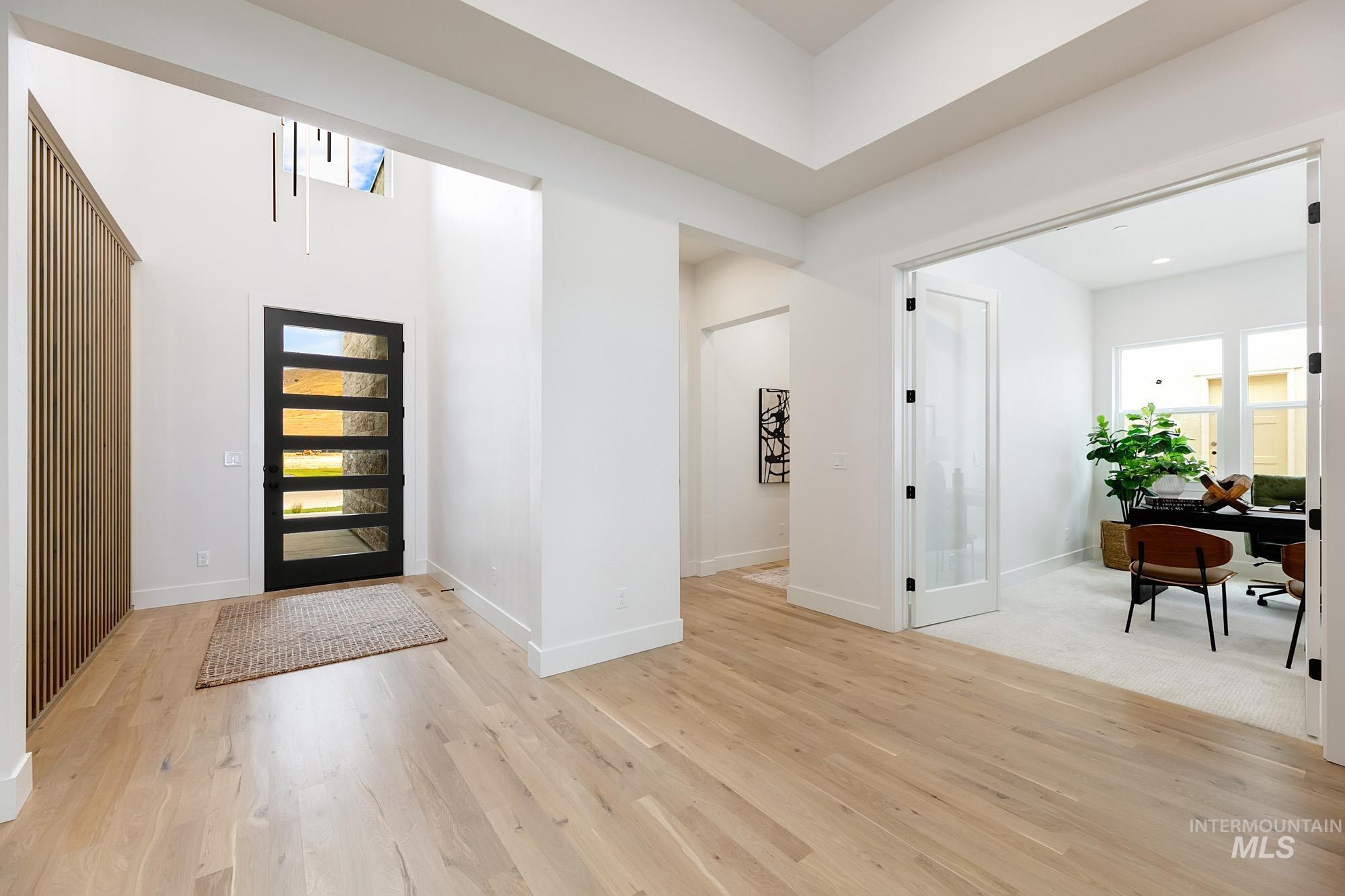 Entrance foyer featuring light wood finished floors and baseboards