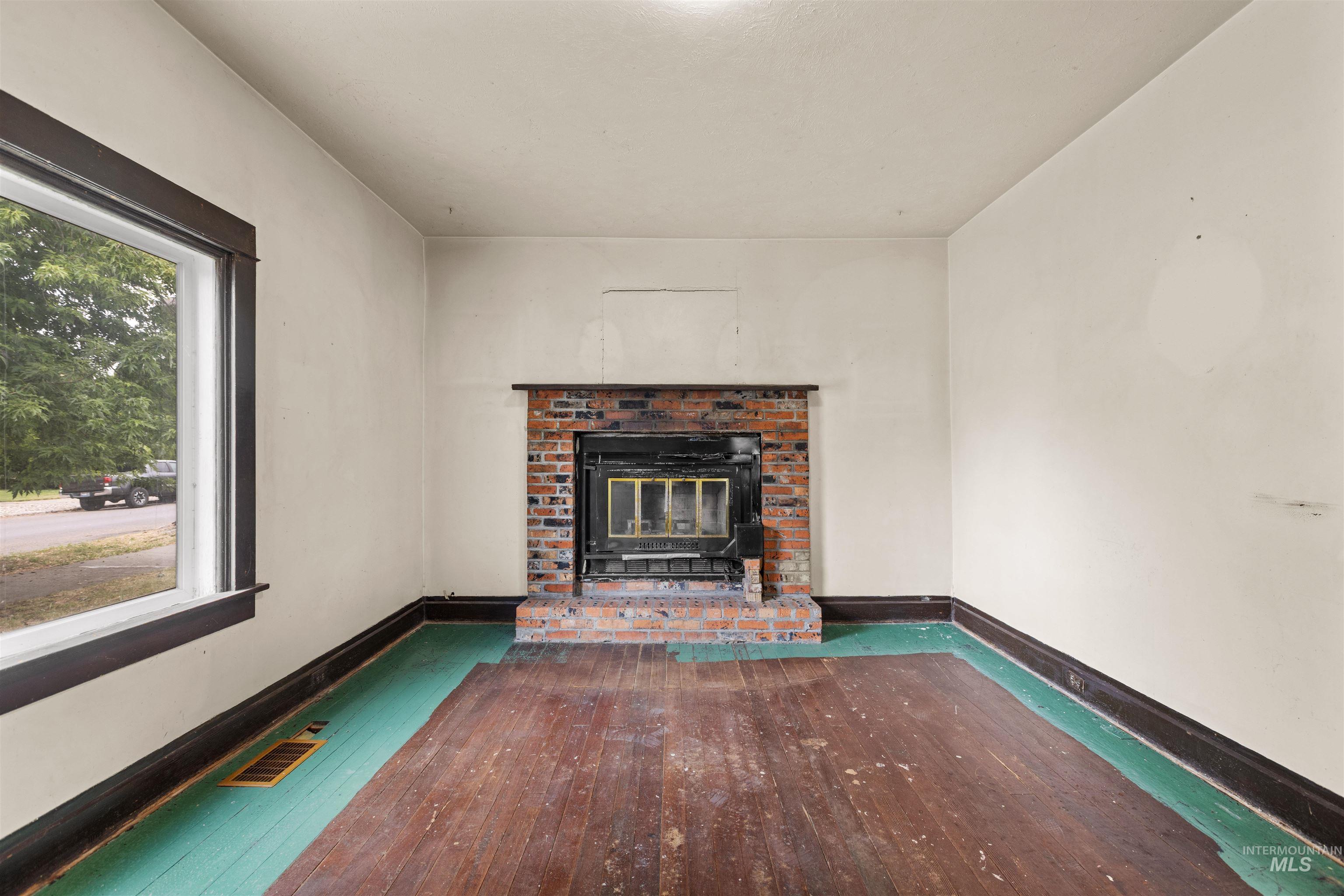 Brick fireplace with an integrated firebox and hearth