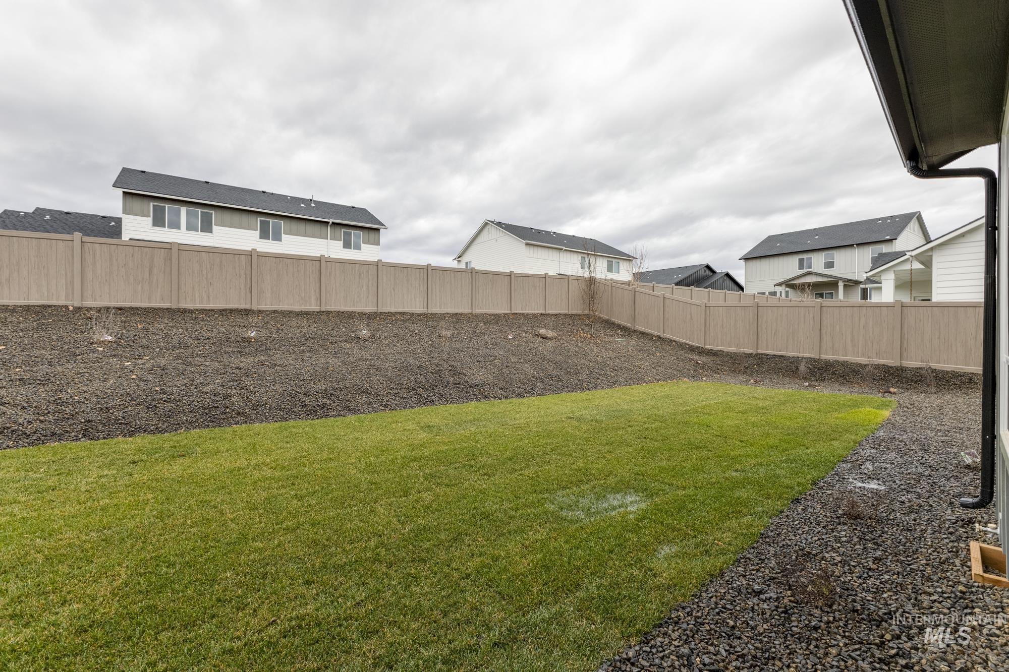 View of fenced backyard