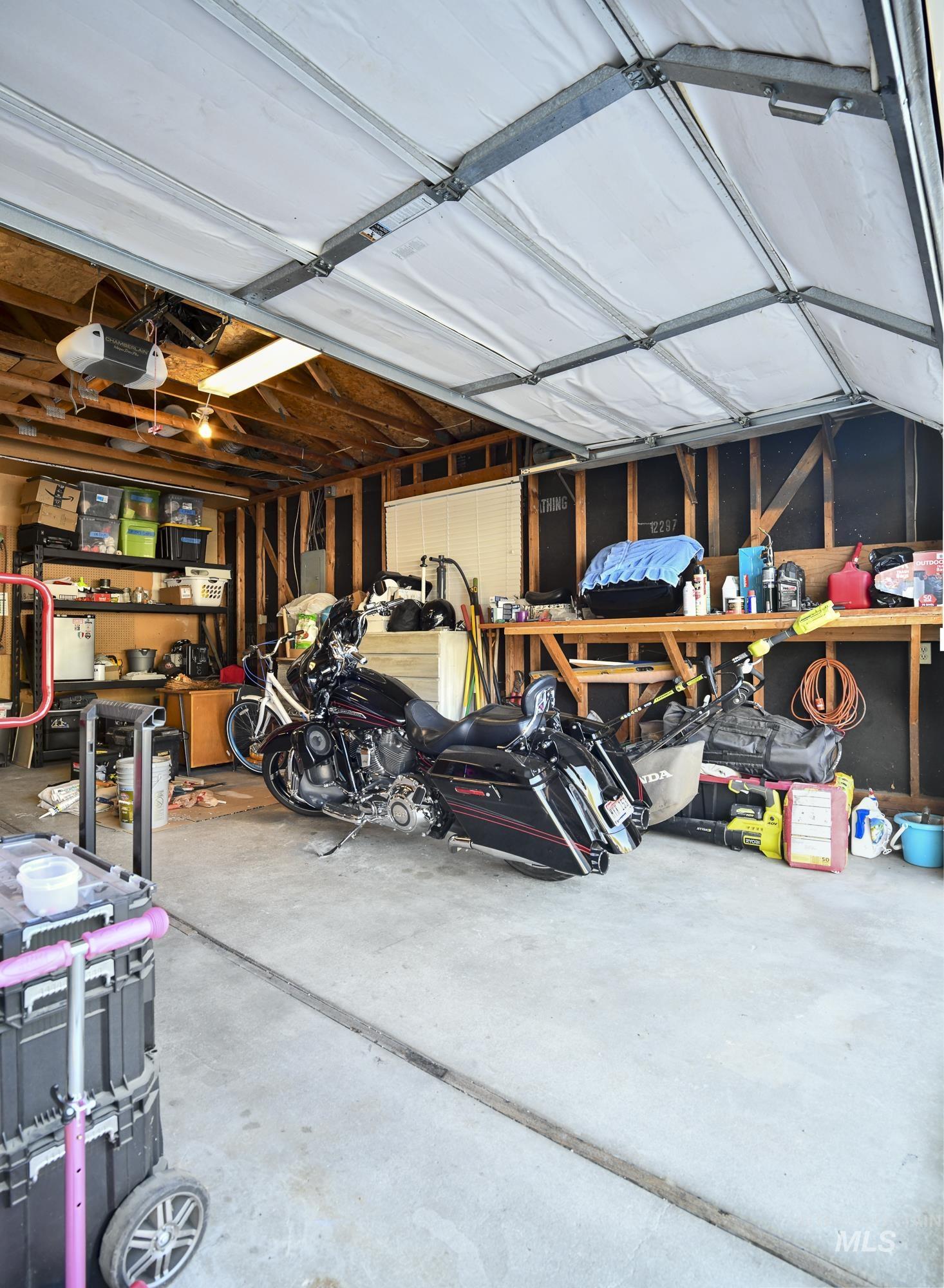Garage featuring a garage door opener
