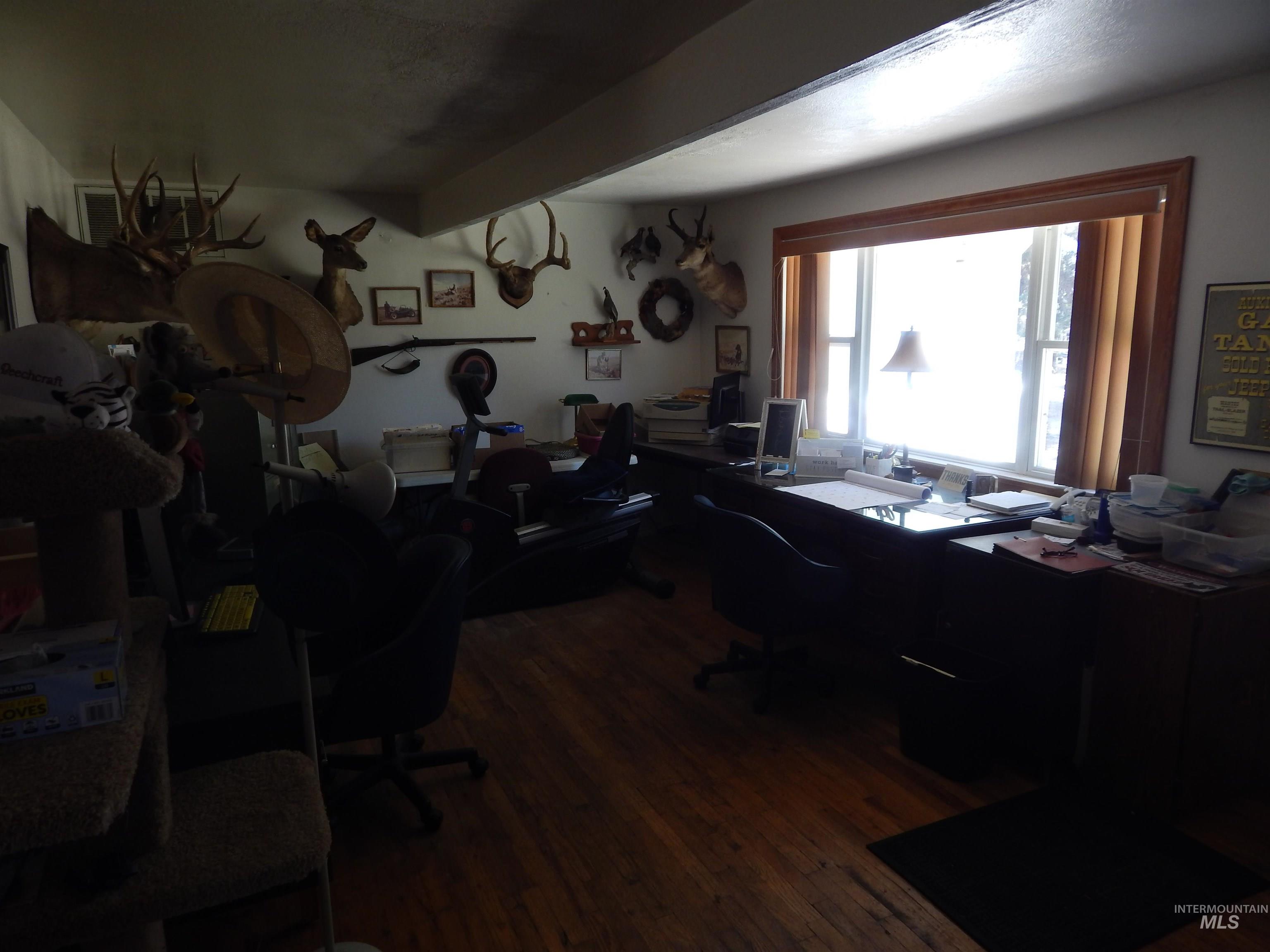 Office space featuring dark wood finished floors