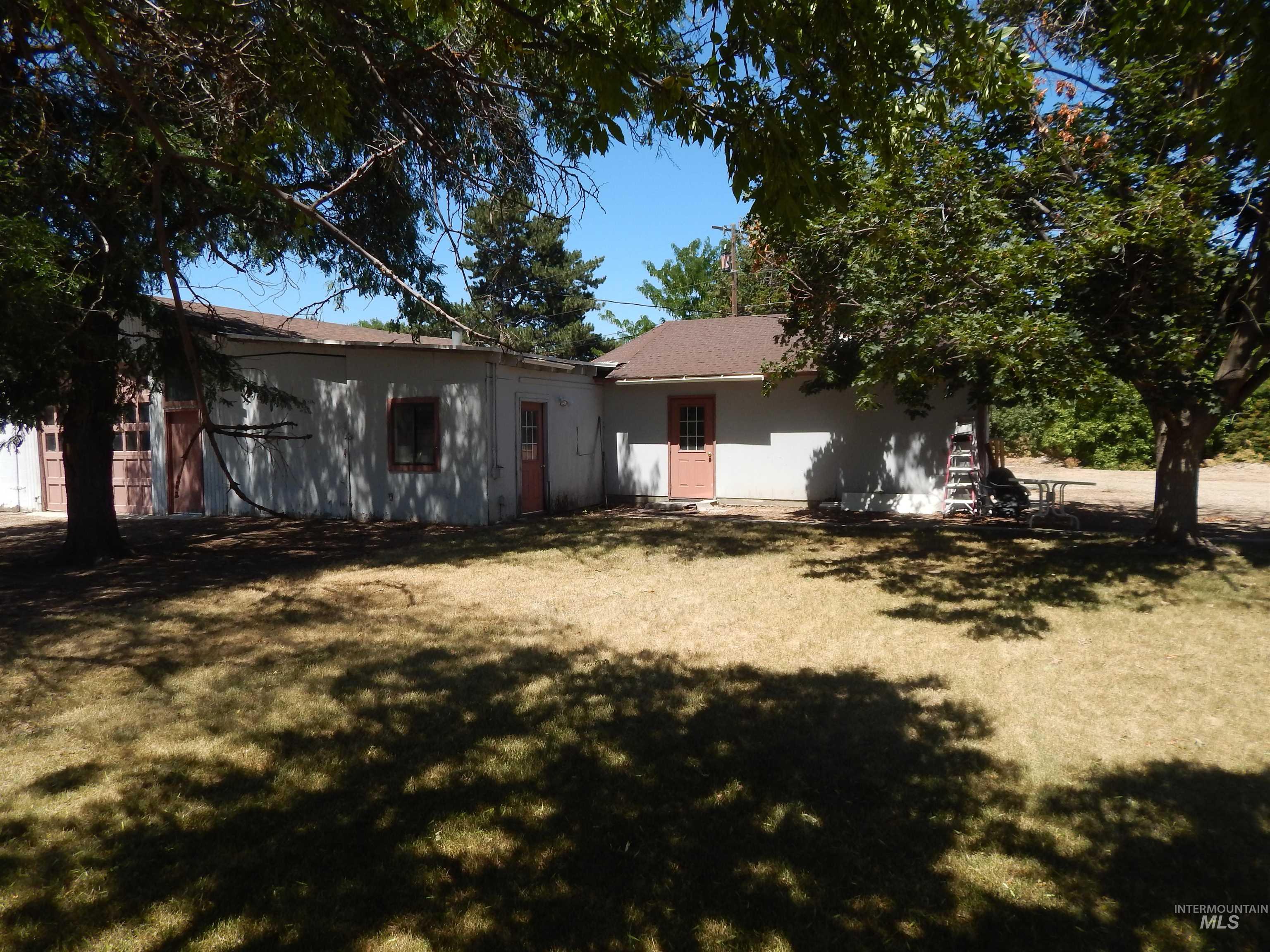 Back of house with a lawn