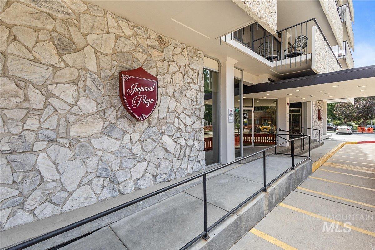 Property entrance with stone siding